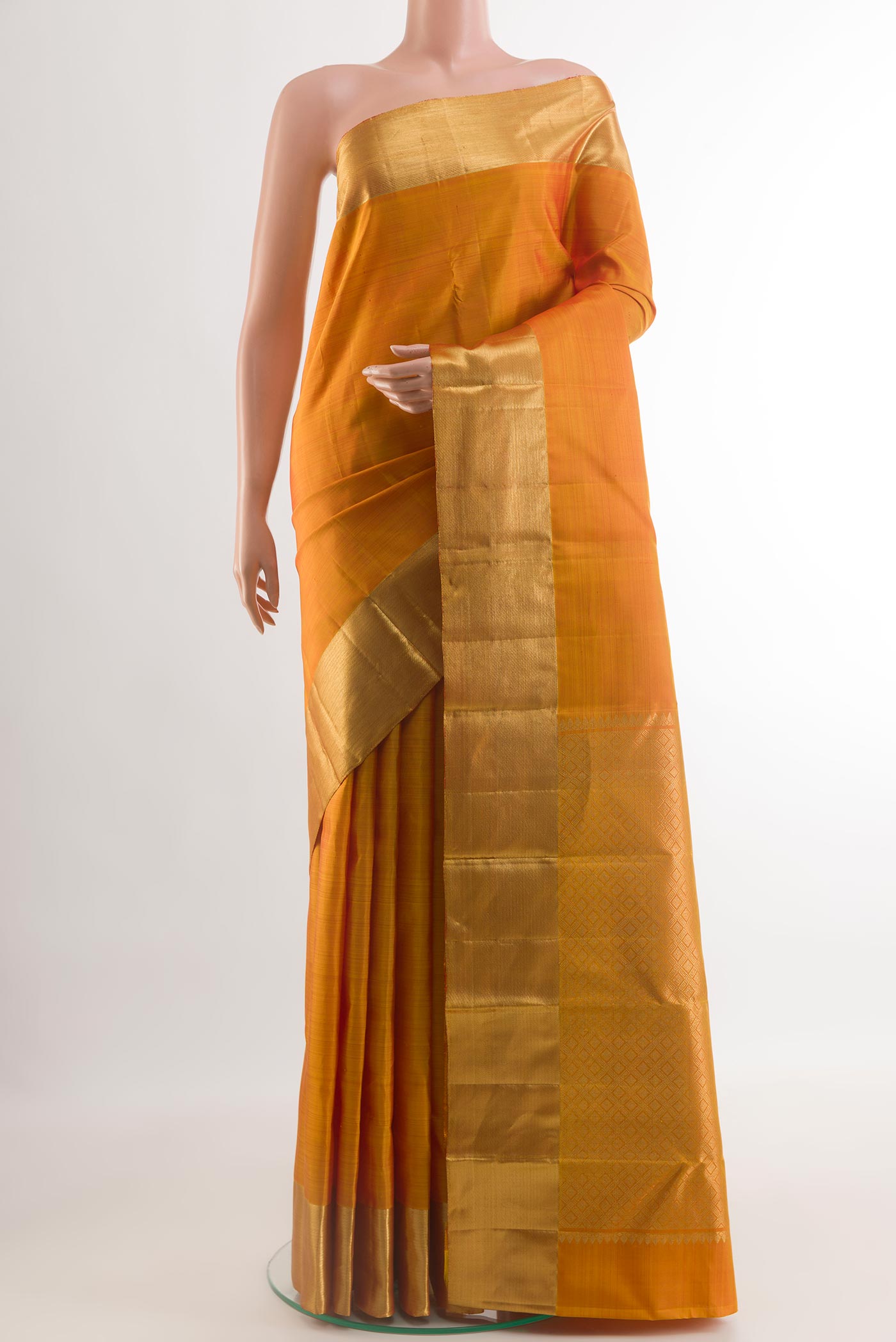Yellow Kanjivaram Silk Saree with Plain Body and Zari Border.  displayed on a mannequin