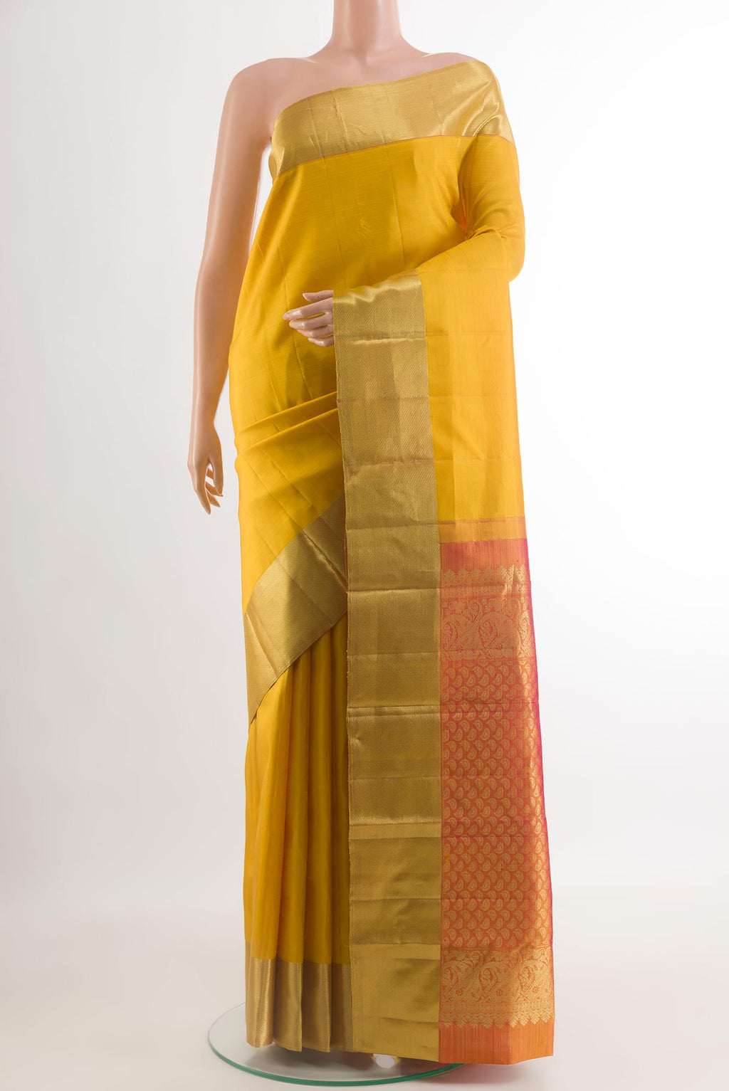 Yellow Kanjivaram Silk Saree with Plain Body and Zari Border.  displayed on a mannequin