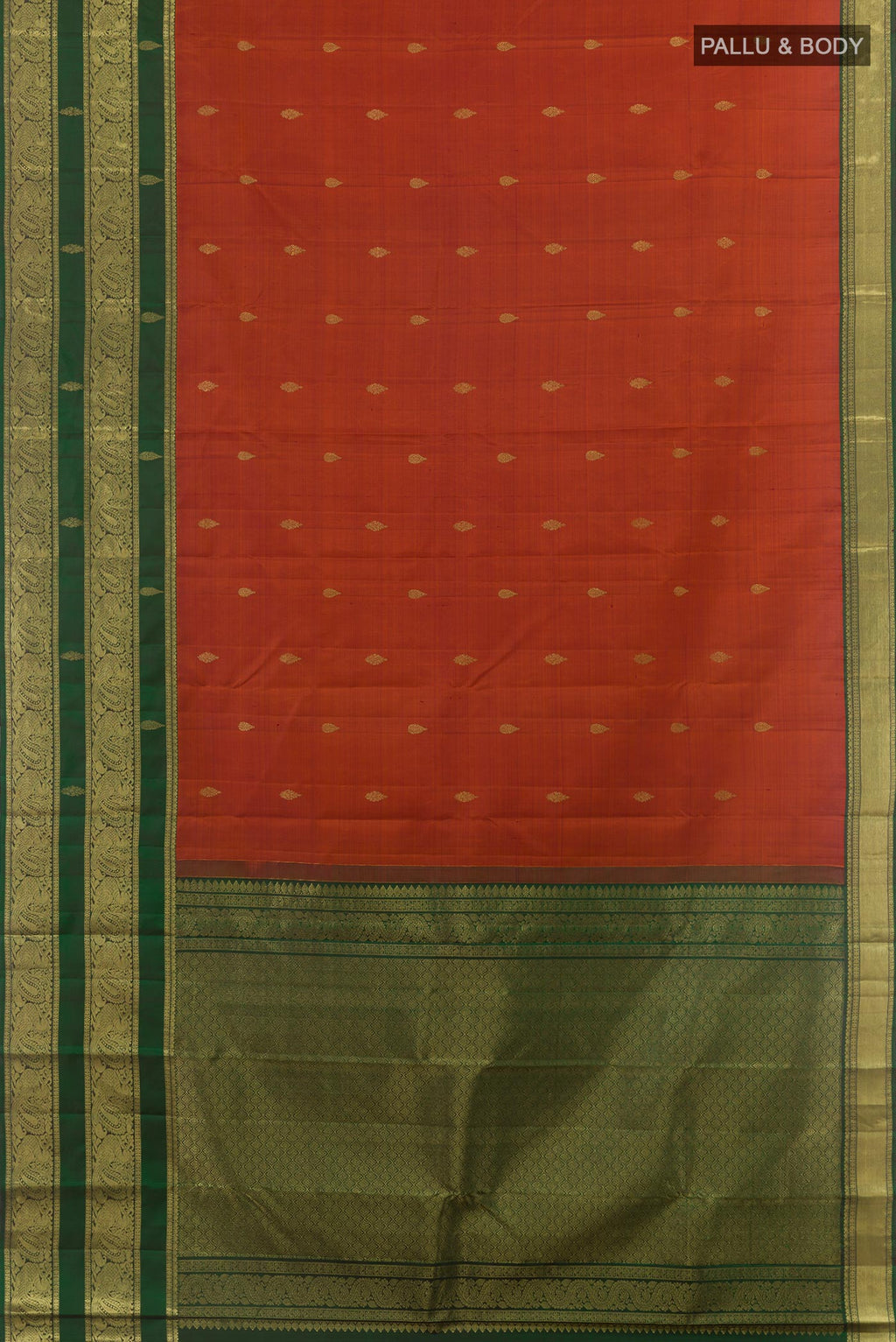 Flat view of Rust Kanchipuram Silk Saree with Zari Butta on the body and Zari Border. 