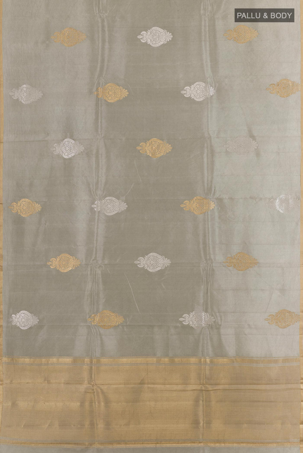 Flat view of Grey Banarasi Katan Silk Saree with Zari Butta on the body and Zari Border. 