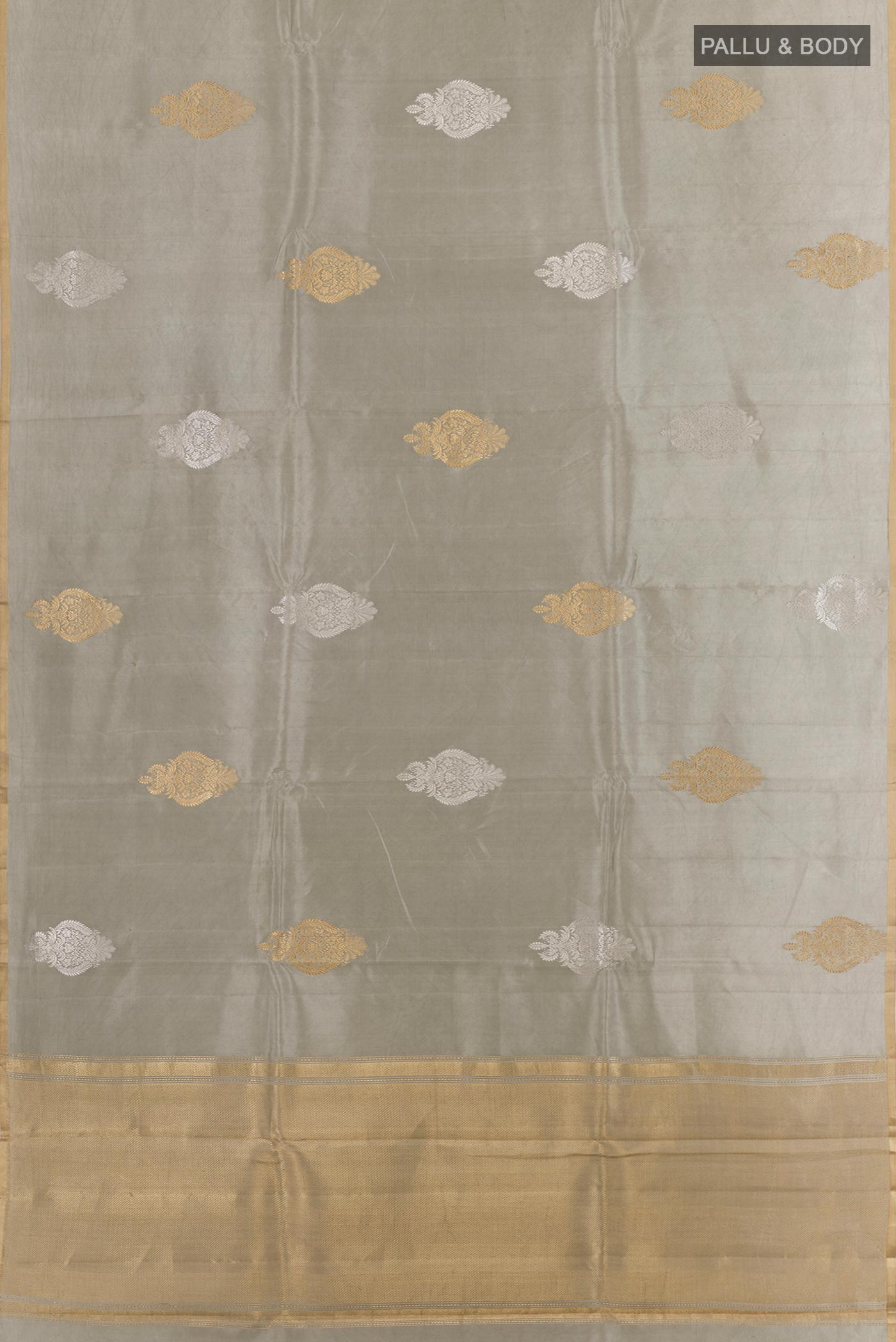 Flat view of Grey Banarasi Katan Silk Saree with Zari Butta on the body and Zari Border. 