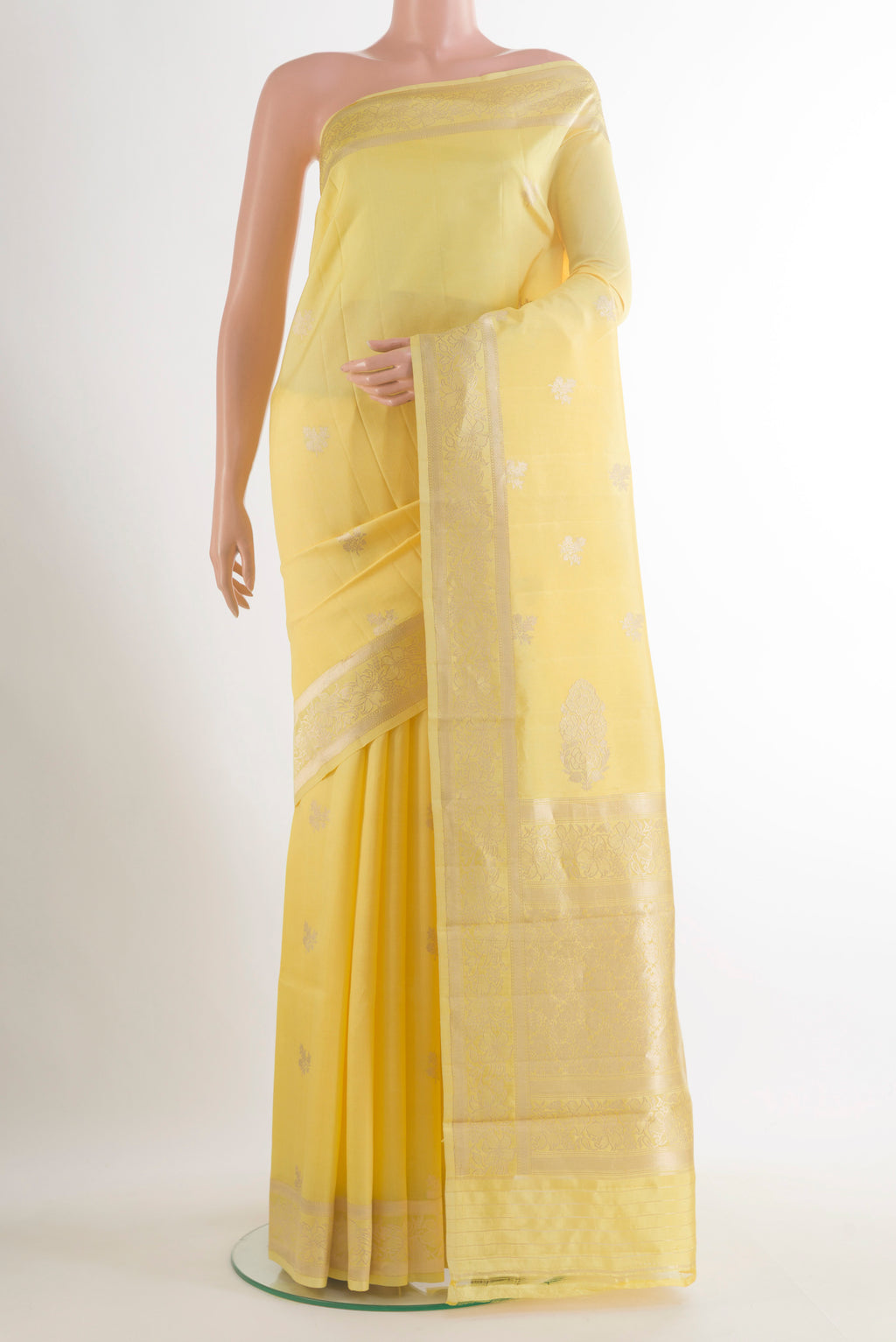 Pure Silk Yellow Banarasi Katan Saree with Zari Butta on the body and Zari Border.  displayed on a mannequin
