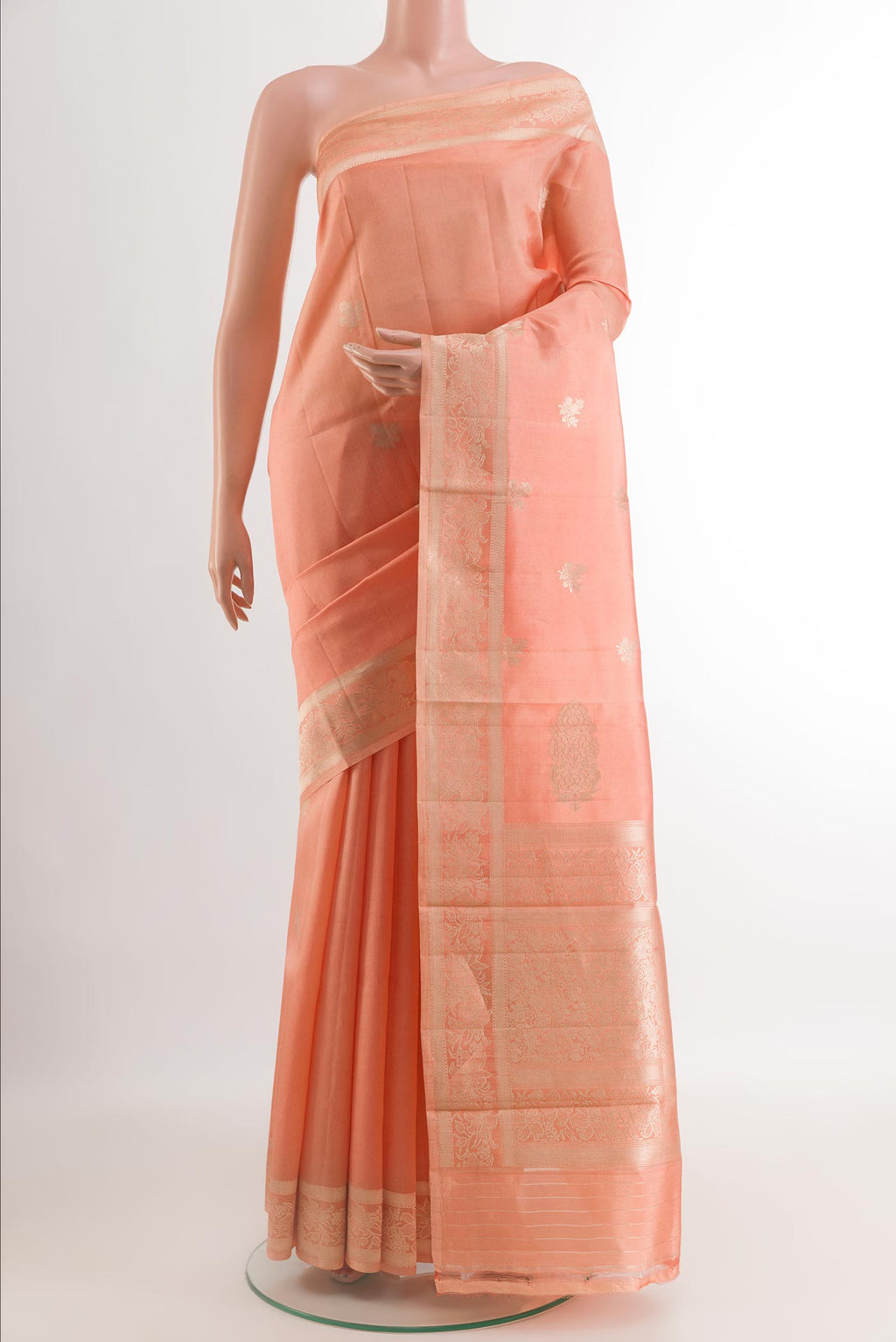 Peach Banarasi Katan Silk Saree with Zari Butta on the body and Zari Border.  displayed on a mannequin