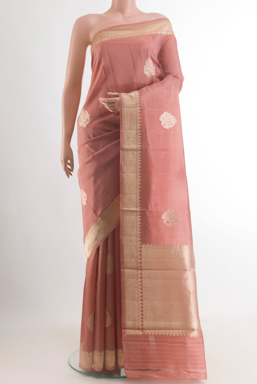 Peach Banarasi Katan Silk Saree with Zari Butta on the body and Zari Border.  displayed on a mannequin