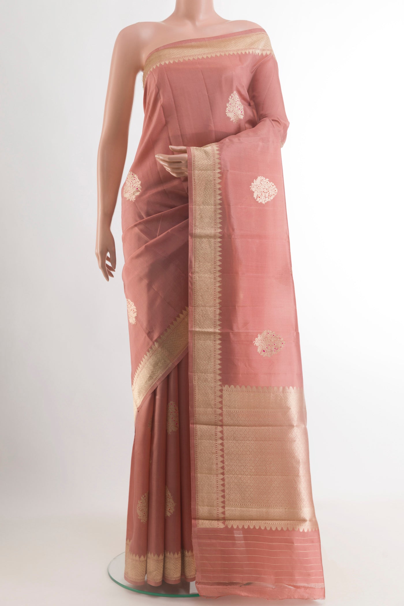 Peach Banarasi Katan Silk Saree with Zari Butta on the body and Zari Border.  displayed on a mannequin