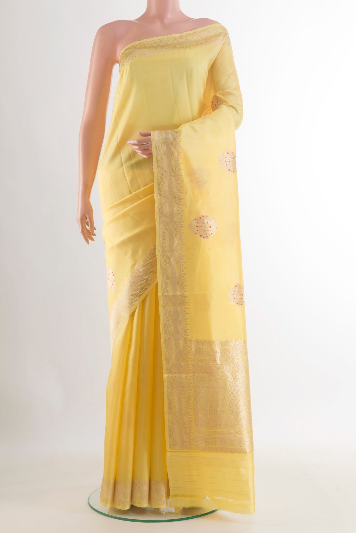 Pure Silk Yellow Banarasi Katan Saree with Zari Butta on the body and Zari Border.  displayed on a mannequin