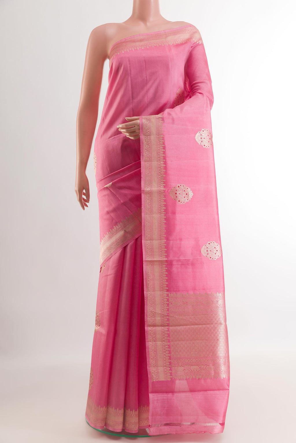 Rose pink Banarasi Katan Silk Saree with Zari Butta on the body and Zari Border.  displayed on a mannequin