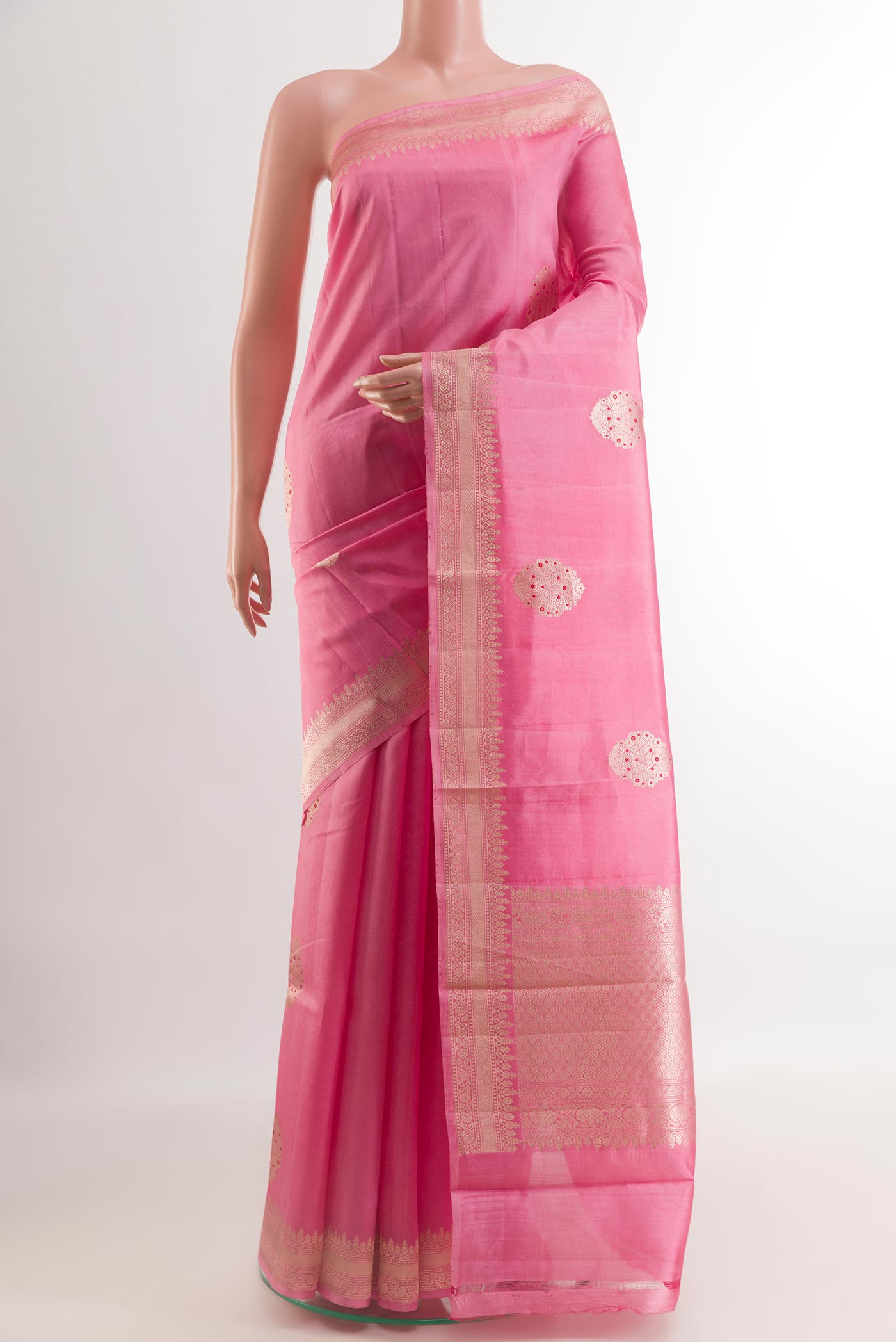 Rose pink Banarasi Katan Silk Saree with Zari Butta on the body and Zari Border.  displayed on a mannequin