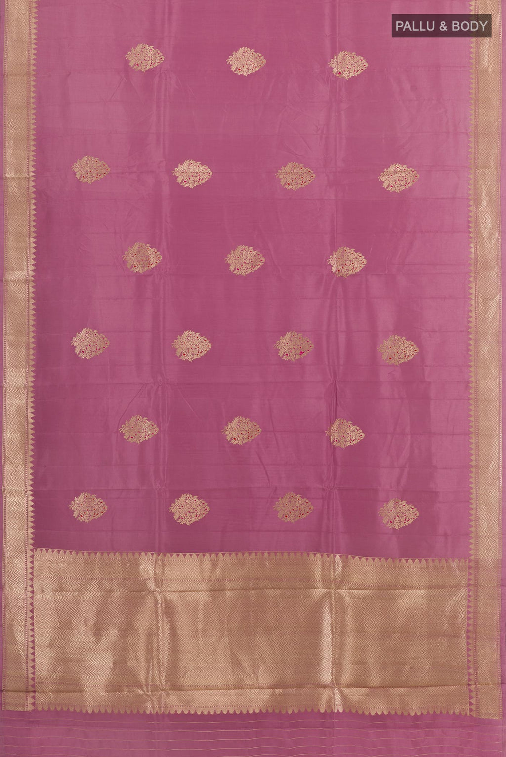 Flat view of Lavender Banarasi Katan Silk Saree with Zari Butta on the body and Zari Border. 