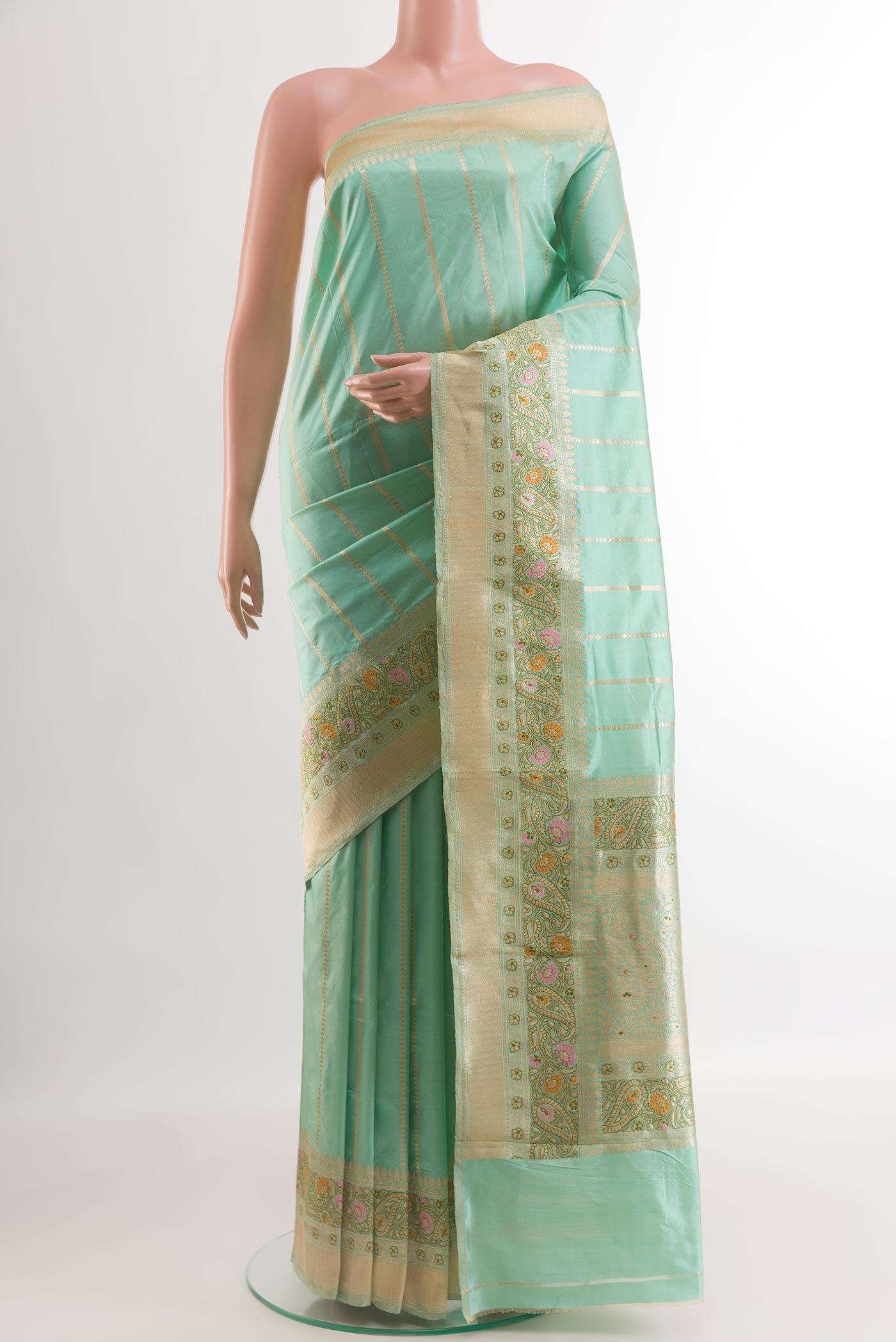 Sea Green Banarasi Katan Silk Saree with Stripes on the body and Zari Border.  displayed on a mannequin