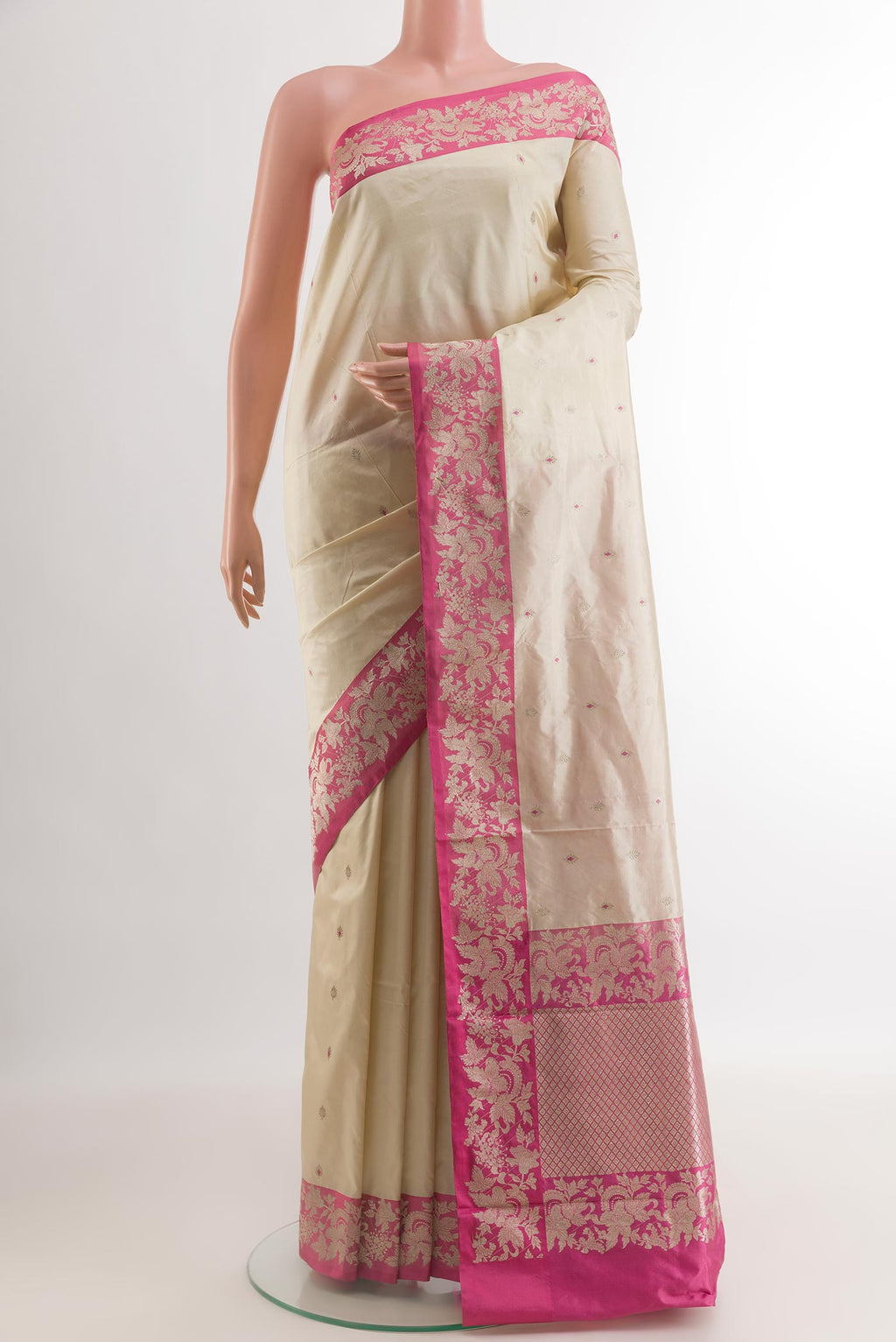 Off White Banarasi Katan Silk Saree with Zari Butta on the body and Zari Border.  displayed on a mannequin