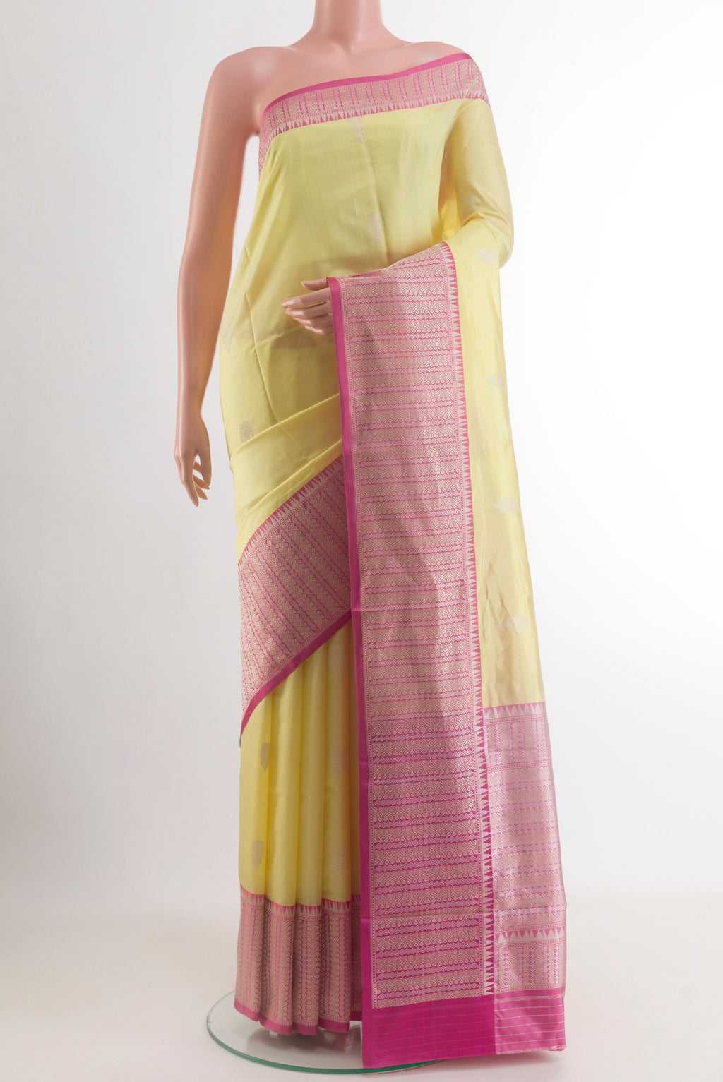 Lemon Yellow Banarasi Katan Silk Saree with Zari Butta on the body and Zari Border.  displayed on a mannequin