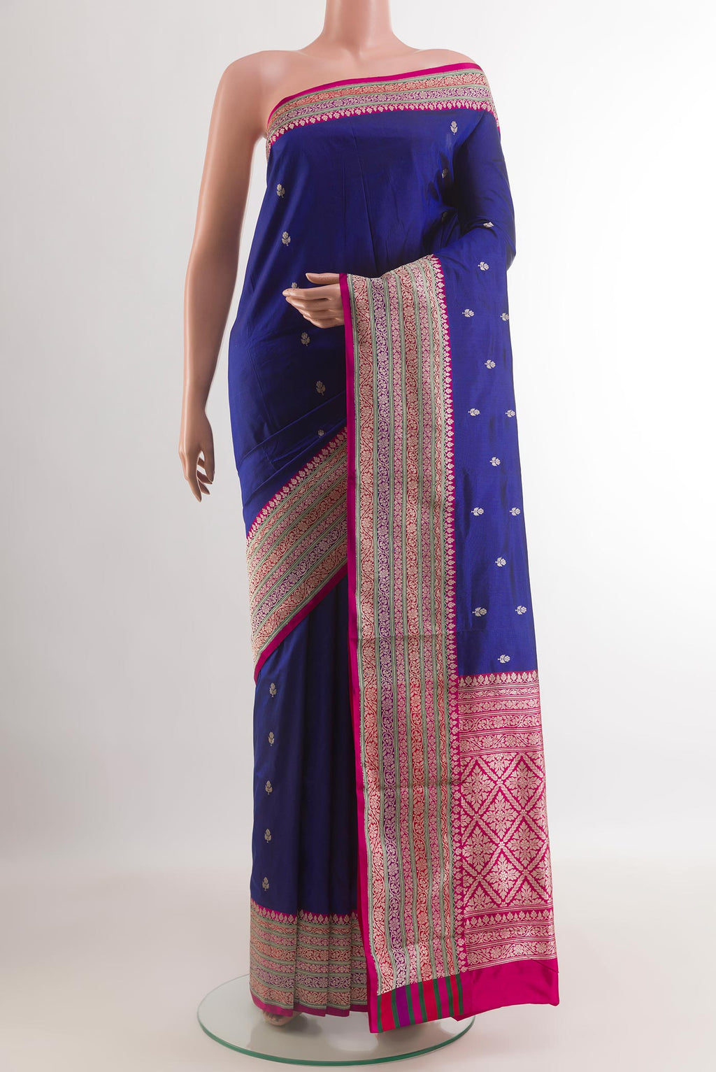 Blue Banarasi Katan Silk Saree with Zari Butta on the body and Zari Border.  displayed on a mannequin
