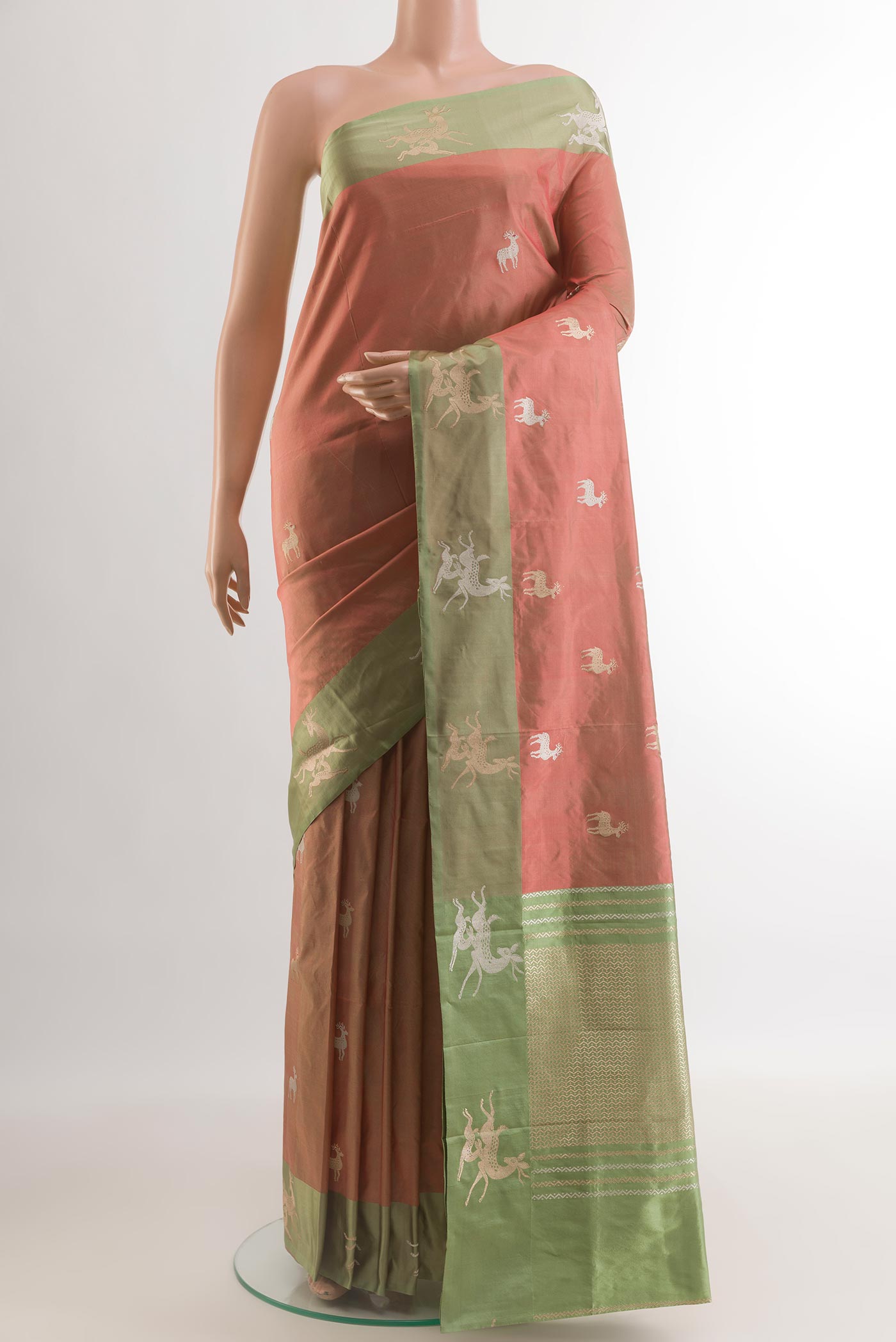 Peach Banarasi Katan Silk Saree with Zari Butta on the body and Zari Border.  displayed on a mannequin