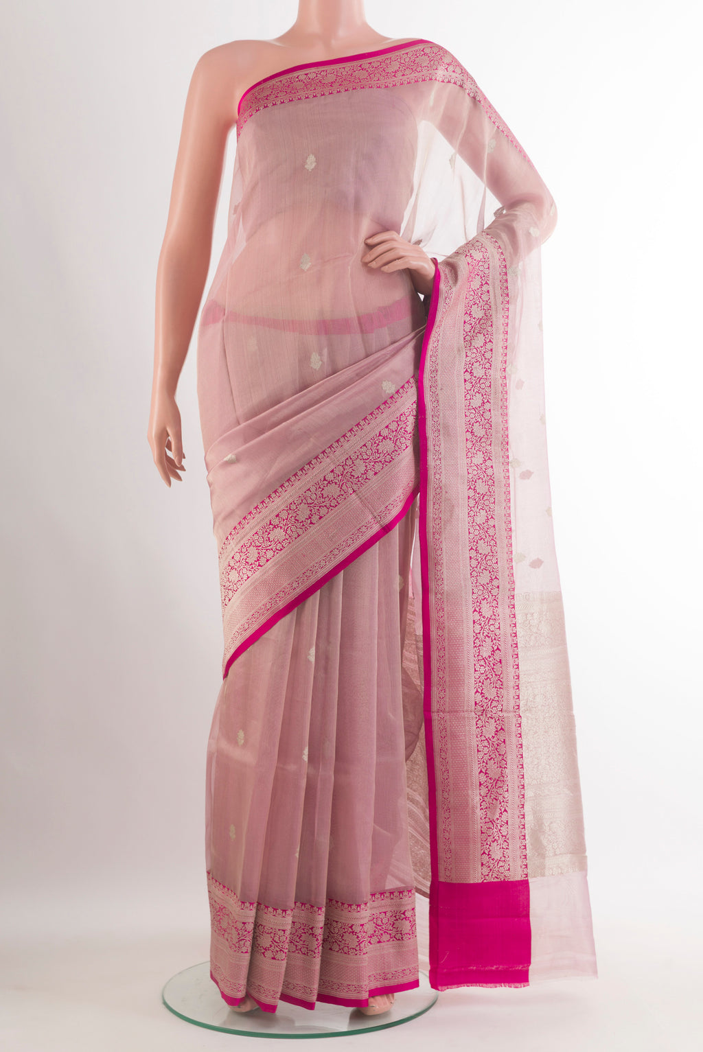 Pure Silk Rose Gold Banarasi Kora Saree with Zari Butta on the body and Zari Border.  displayed on a mannequin