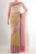 Pure Silk Beige Banarasi Kora Saree with Zari Butta on the body and Zari Border.  displayed on a mannequin