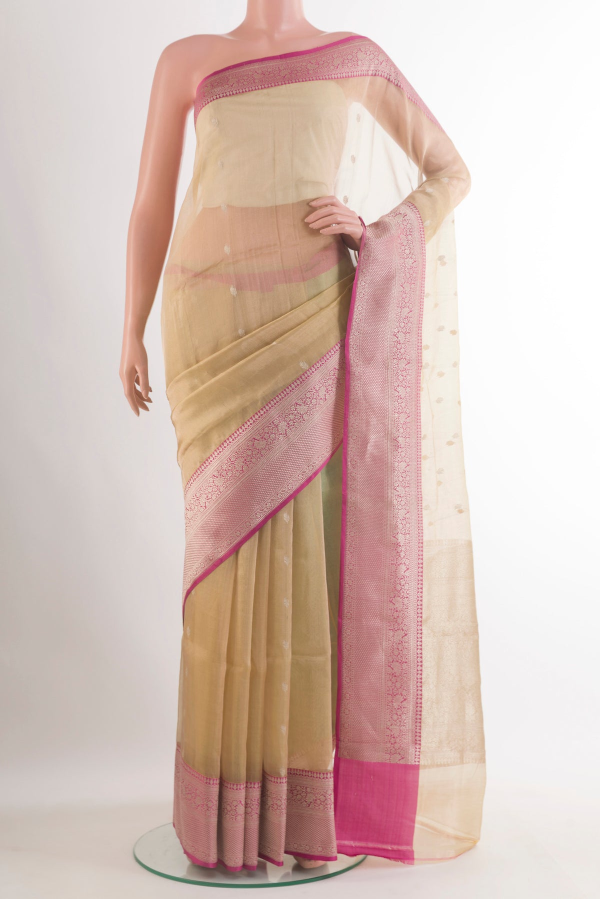 Pure Silk Beige Banarasi Kora Saree with Zari Butta on the body and Zari Border.  displayed on a mannequin