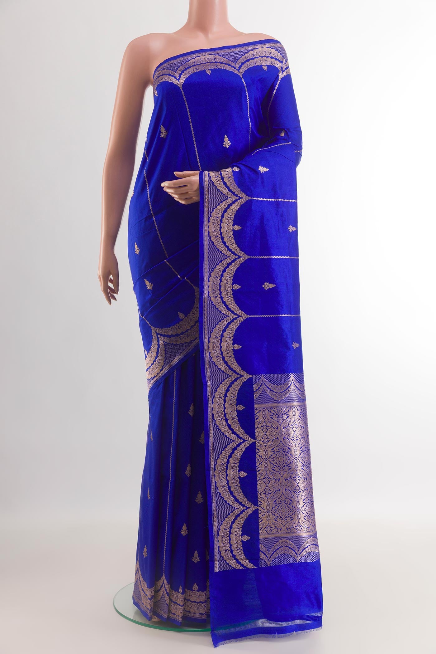 Blue Banarasi Katan Silk Saree with Zari Butta on the body and Zari Border.  displayed on a mannequin