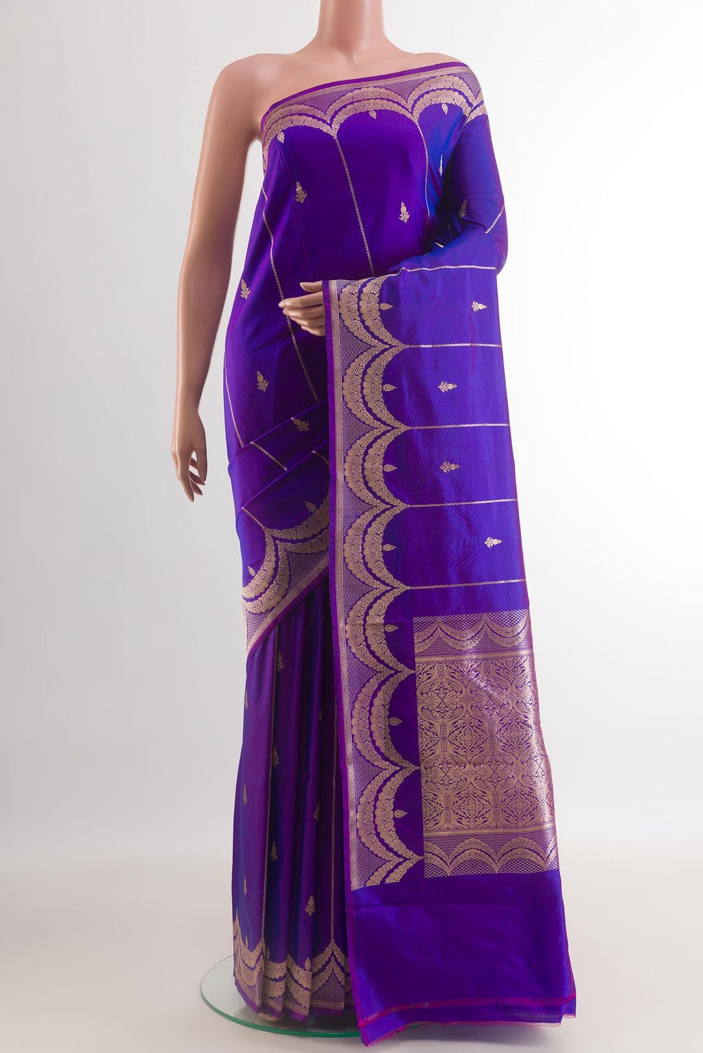 Royal Blue Banarasi Katan Silk Saree with Zari Butta on the body and Zari Border.  displayed on a mannequin