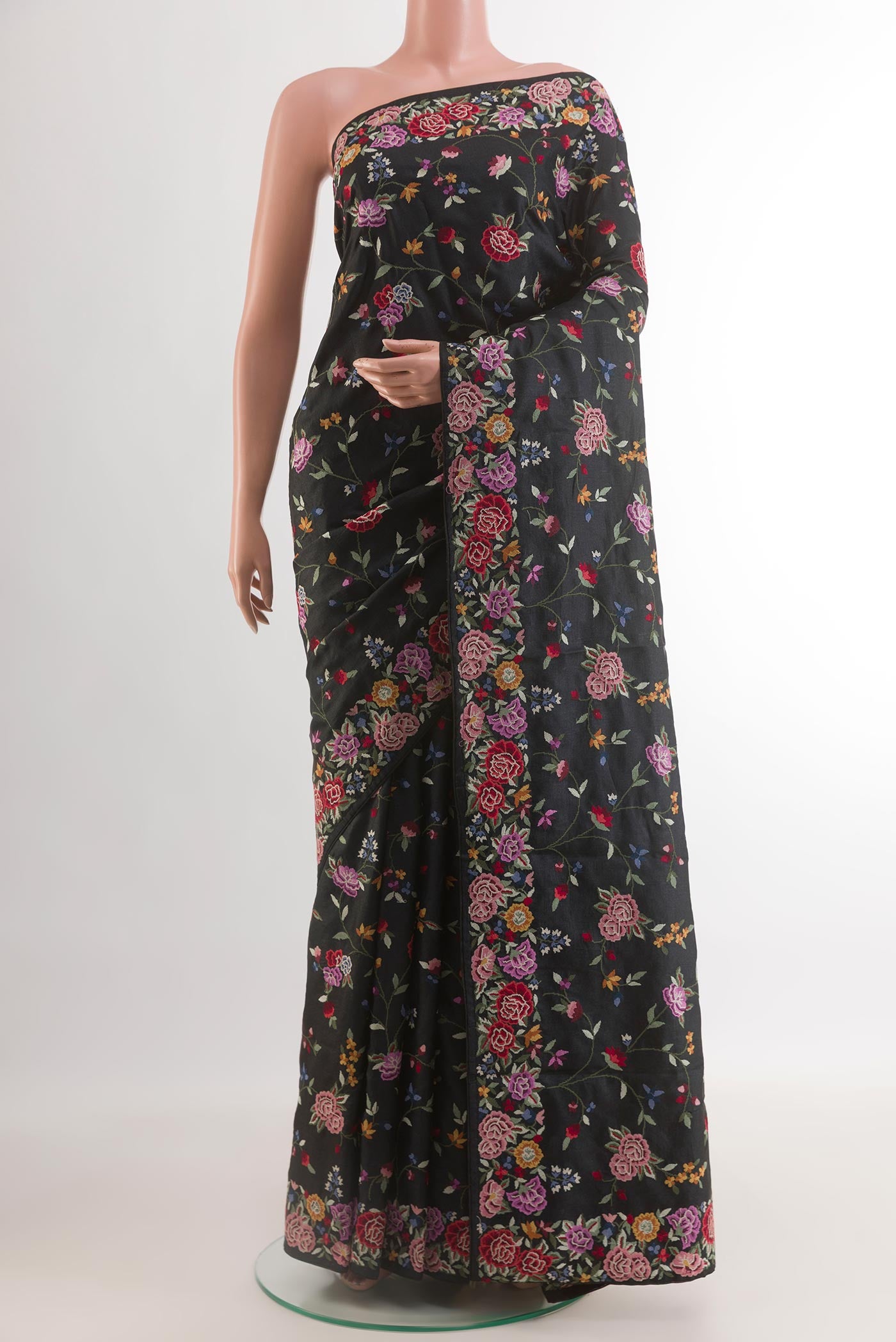 Black Tussar Silk Saree with Embroidery on the body and Embroidery Border.  displayed on a mannequin