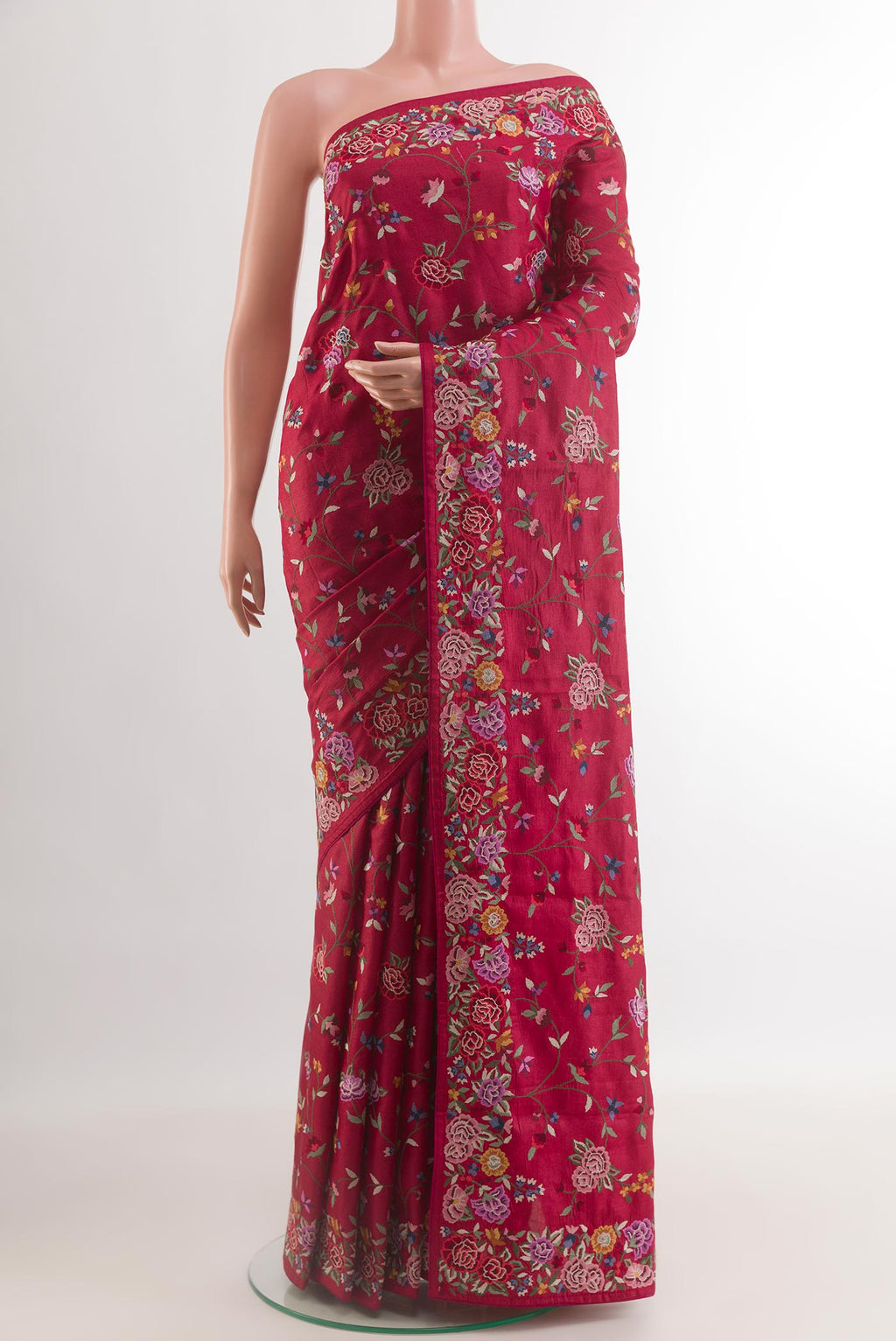 Red Tussar Silk Saree with Embroidery on the body and Embroidery Border.  displayed on a mannequin