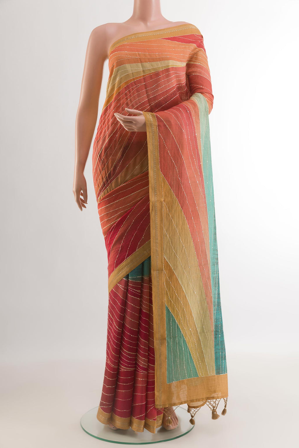 Multi Color Tussar Silk Saree with Embroidery on the body and Zari Border.  displayed on a mannequin
