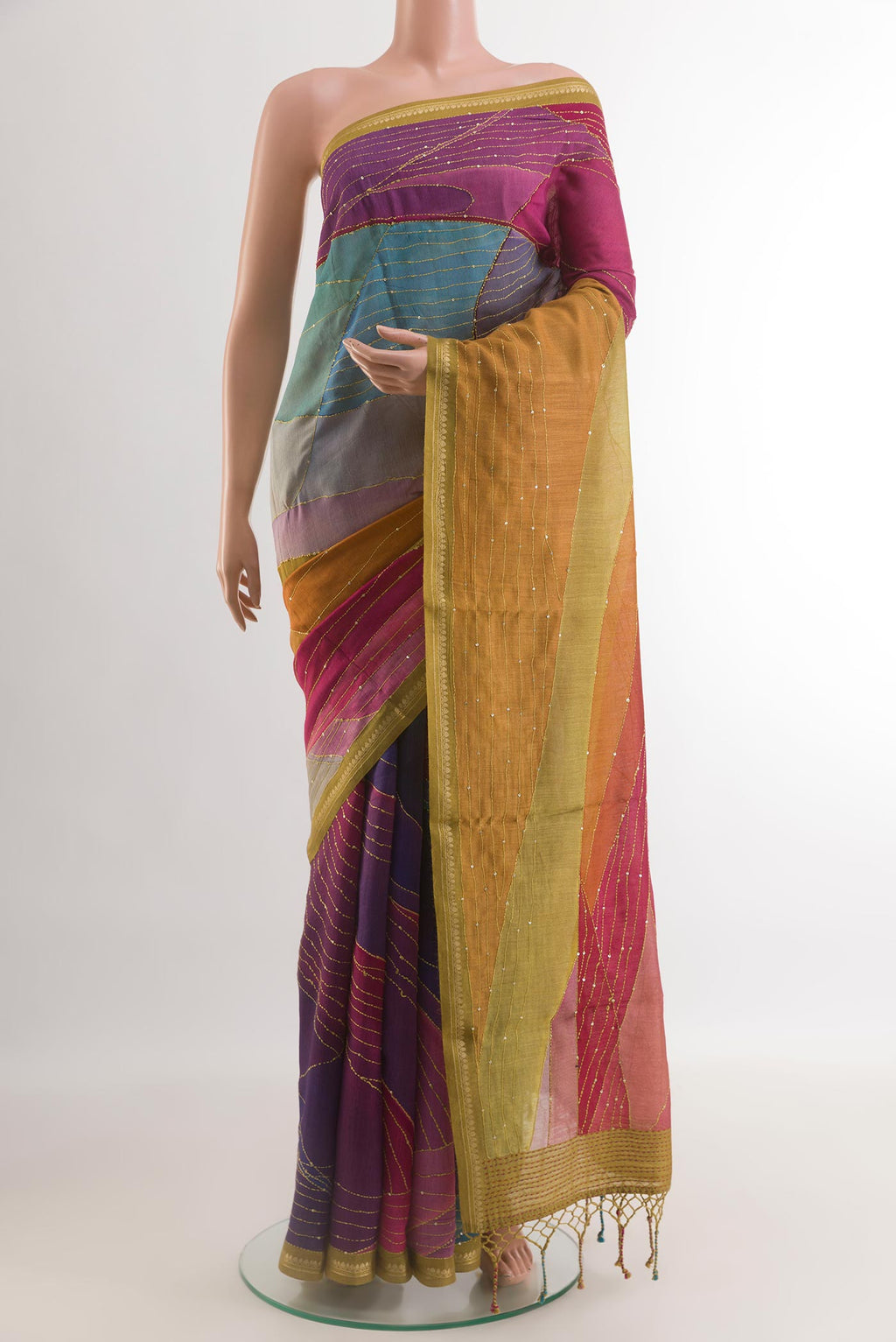 Multi Color Tussar Silk Saree with Embroidery on the body and Zari Border.  displayed on a mannequin