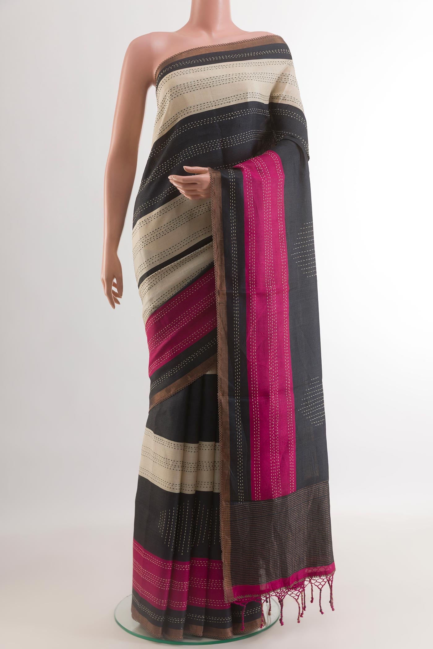 Multi Color Tussar Silk Saree with Embroidery on the body and Zari Border.  displayed on a mannequin