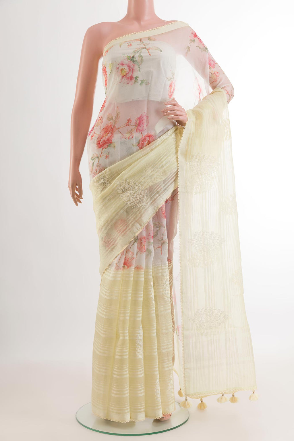 Off White Organza Silk Saree with Embroidery on the body and Embroidery Border.  displayed on a mannequin