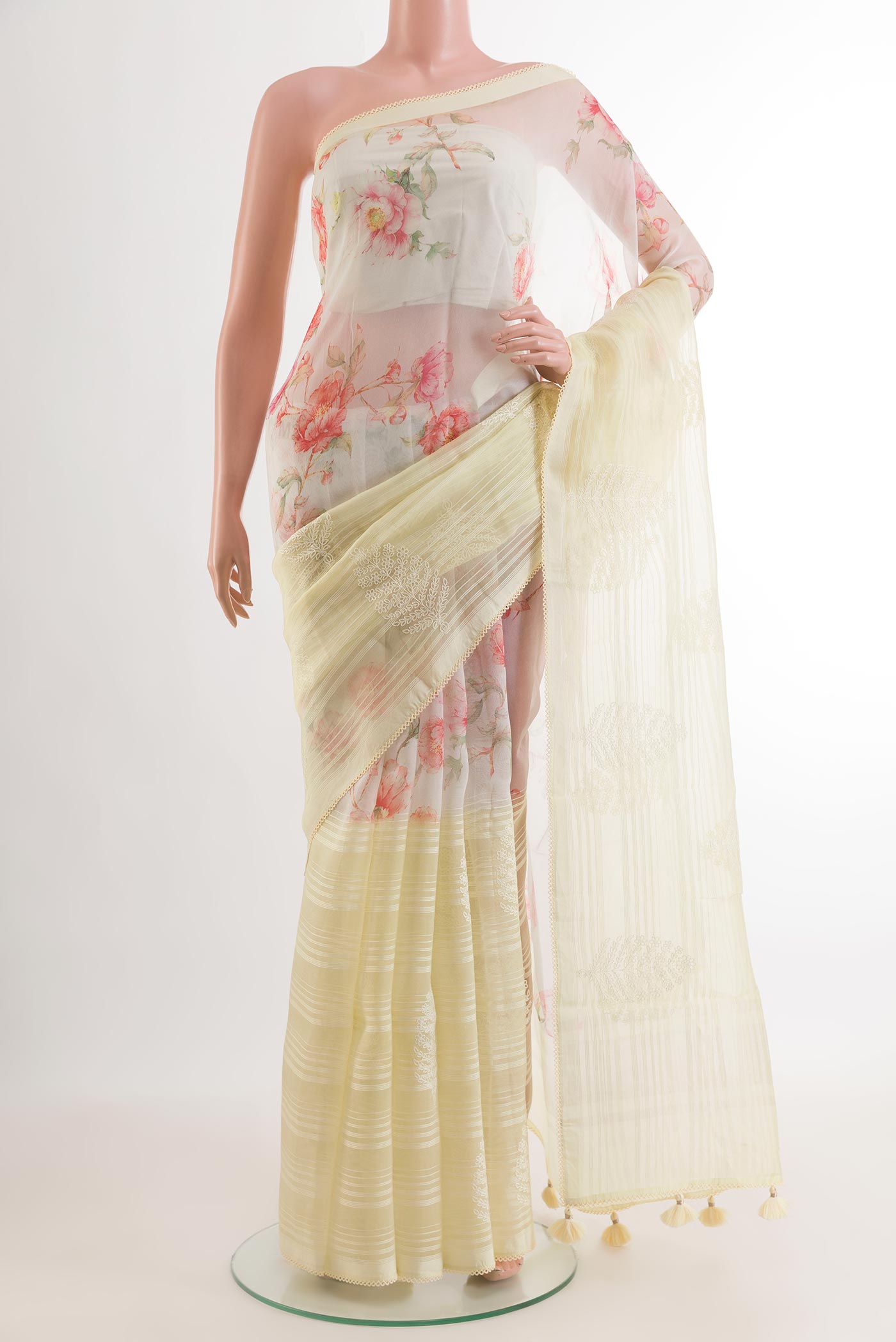 Off White Organza Silk Saree with Embroidery on the body and Embroidery Border.  displayed on a mannequin