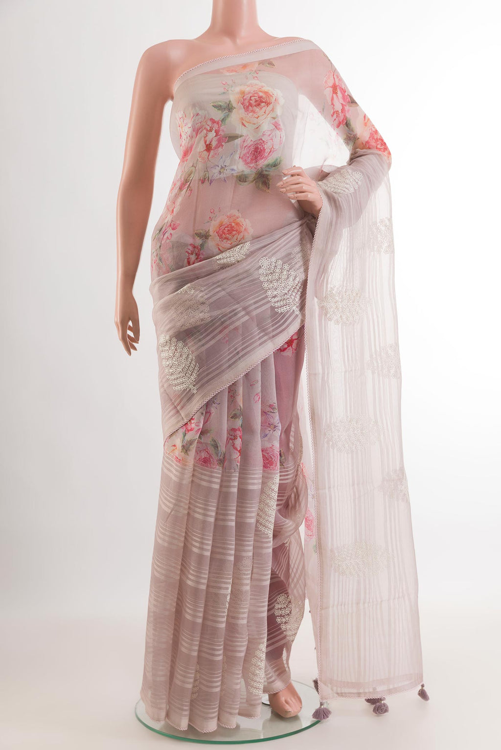 Lavender Organza Silk Saree with Floral Print on the body and Embroidery Border.  displayed on a mannequin