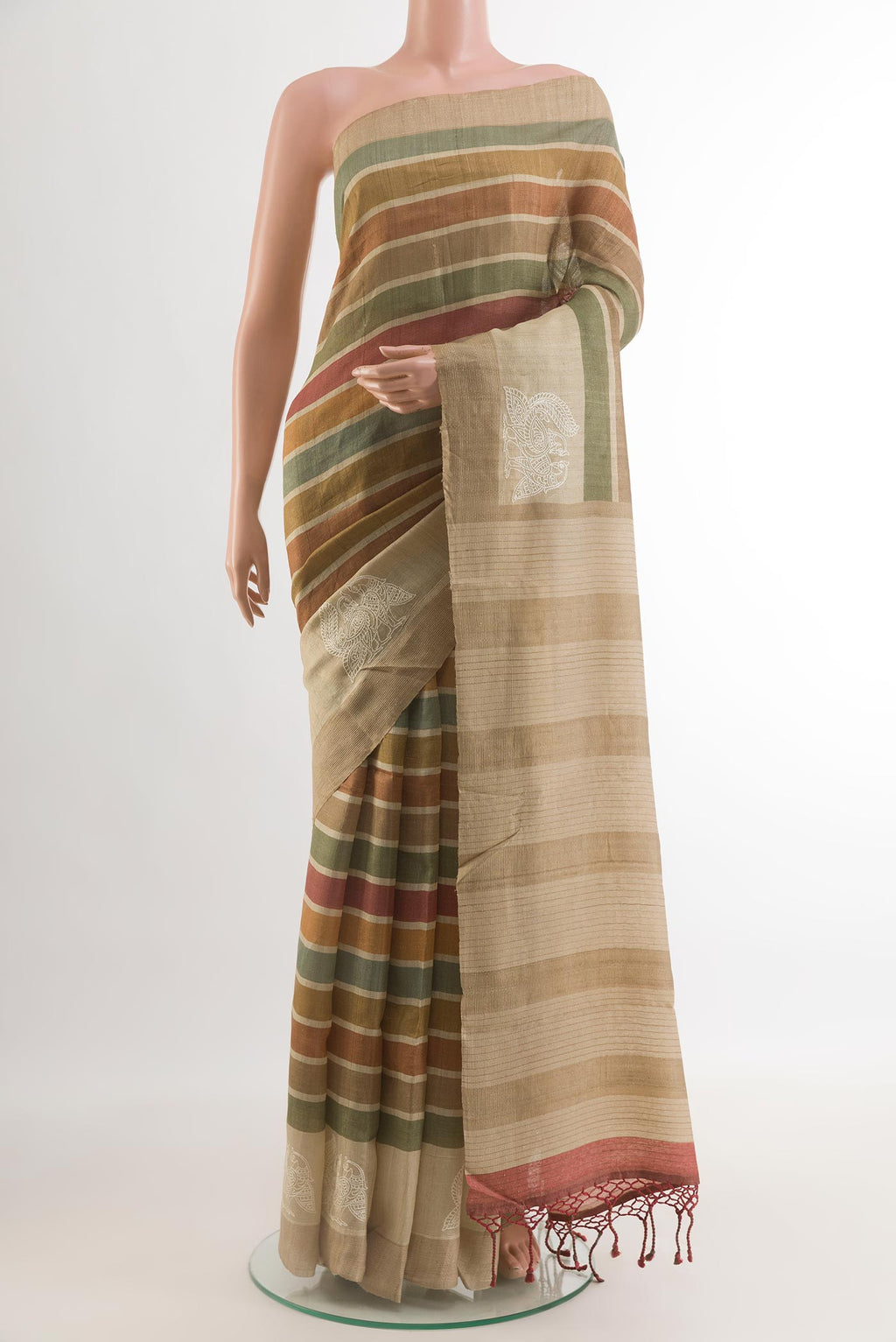 Multi Color Tussar Silk Saree with Printed design on the body and Zari Border.  displayed on a mannequin