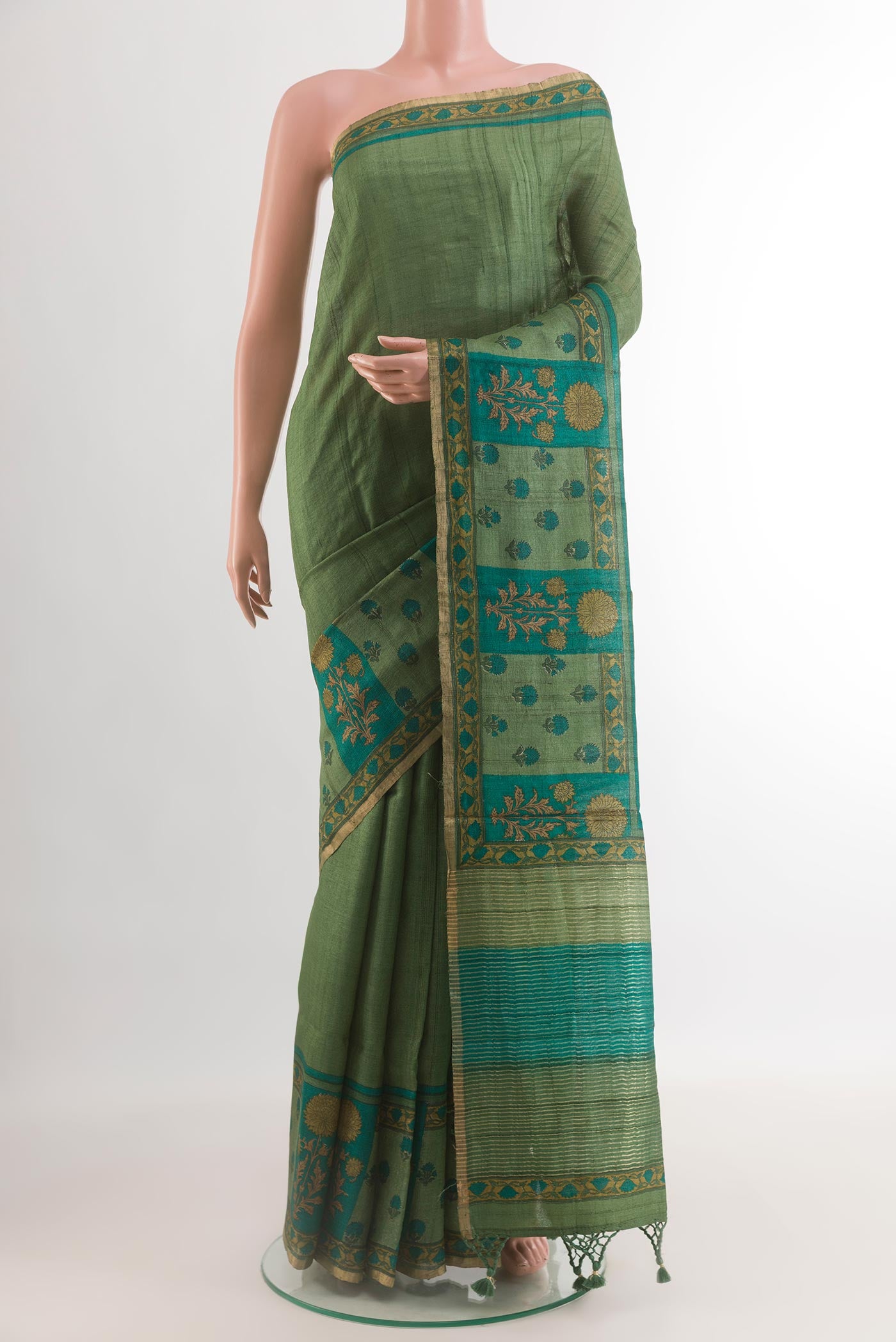 Green Tussar Silk Saree with Plain Body and Printed Border.  displayed on a mannequin