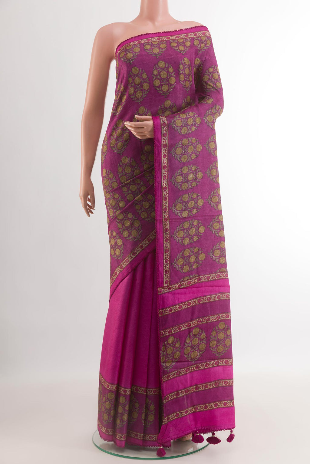 Light Magenta Tussar Silk Saree with Printed design on the body and Printed Border.  displayed on a mannequin