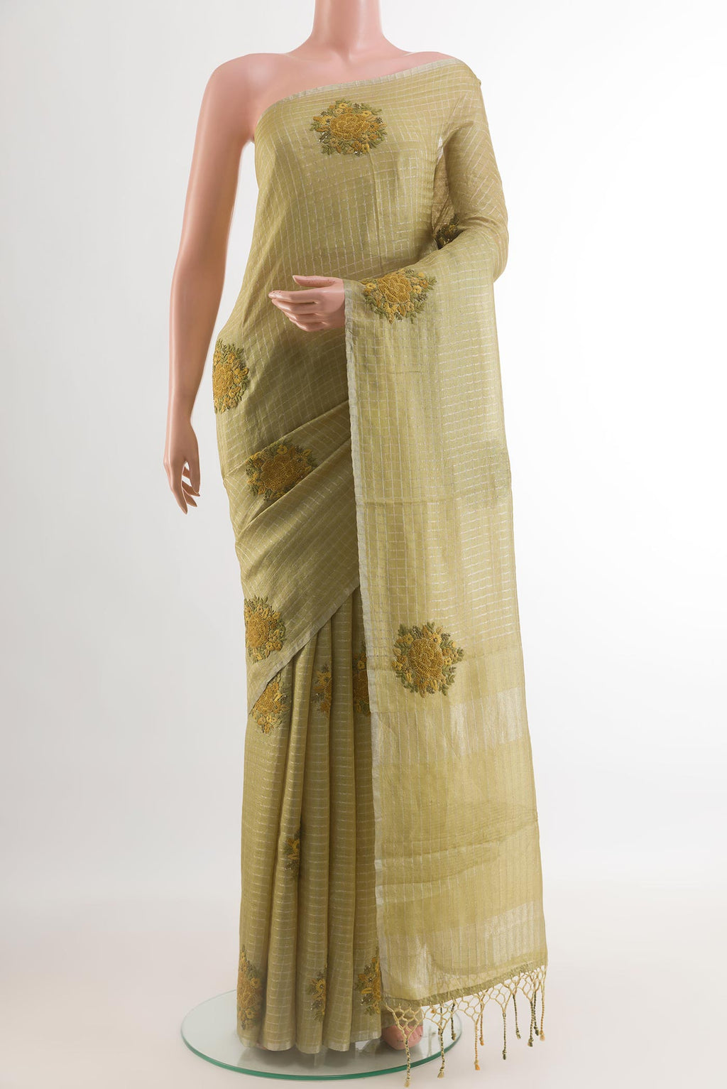 Green Tussar Silk Saree with Checked design on the body and Embroidery Border.  displayed on a mannequin