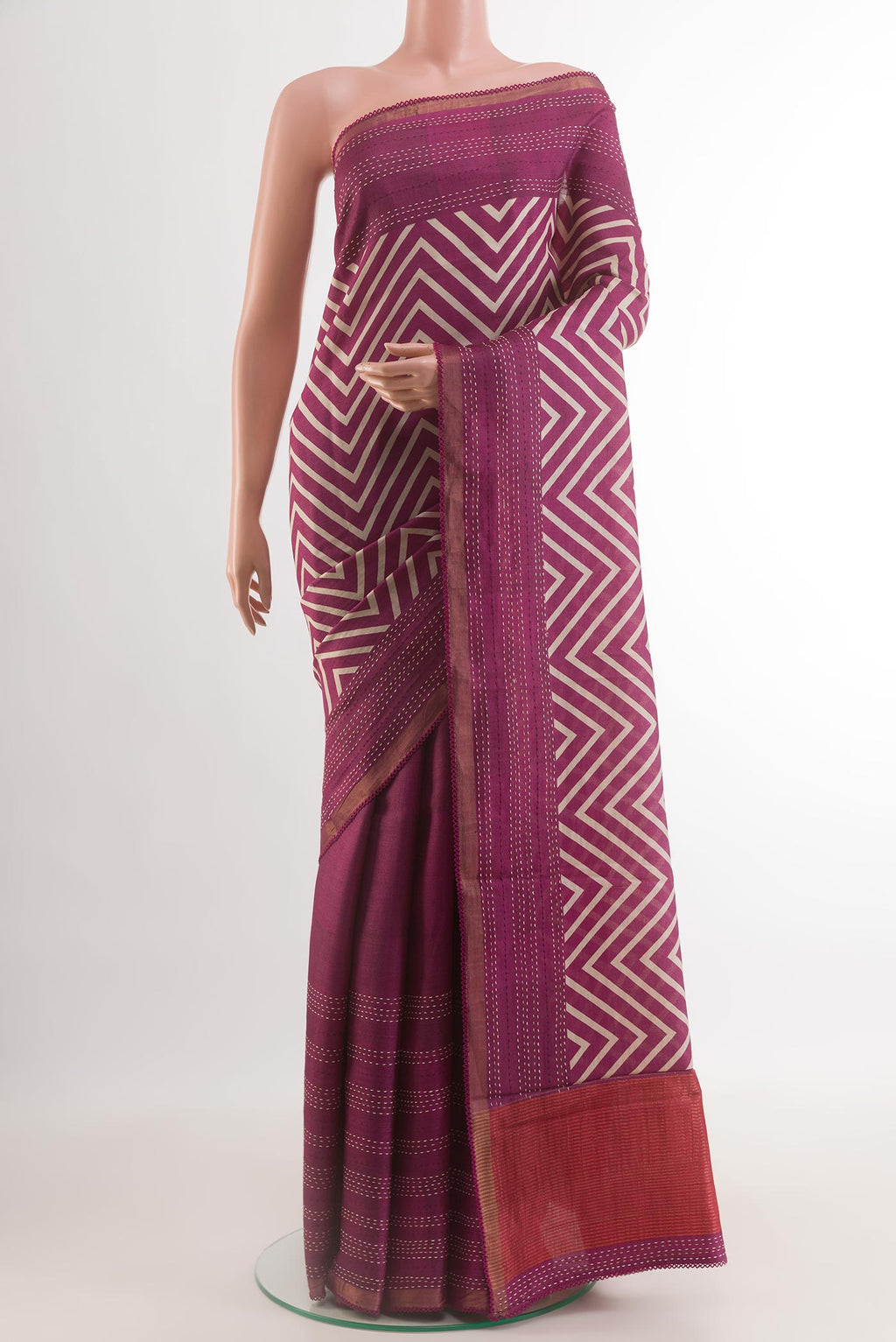 Purple Tussar Silk Saree with Printed design on the body and Zari Border.  displayed on a mannequin