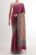 Magenta Tussar Silk Saree with Plain Body and Zari Border.  displayed on a mannequin