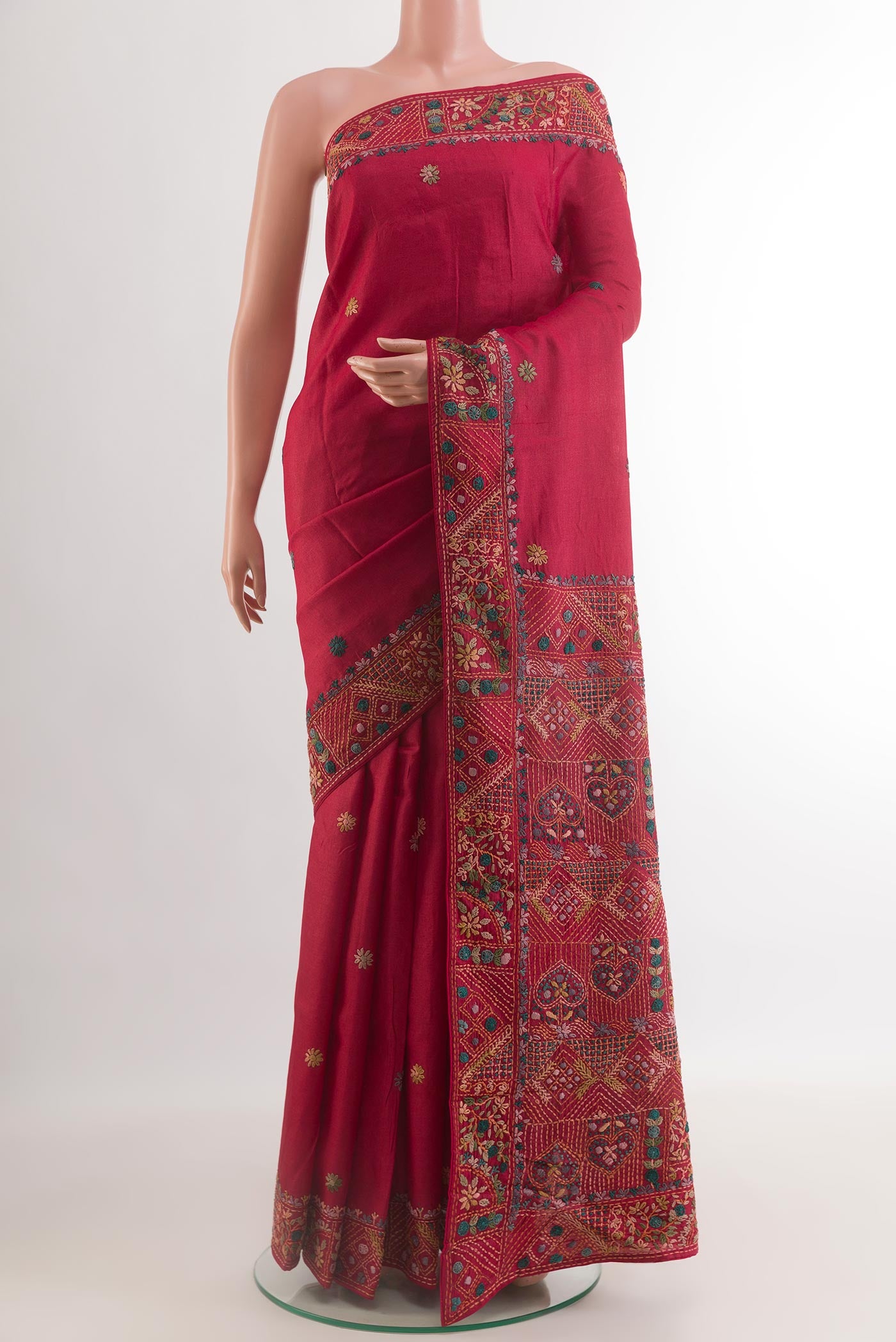 Red Tussar Silk Saree with Embroidery on the body and Embroidery Border.  displayed on a mannequin