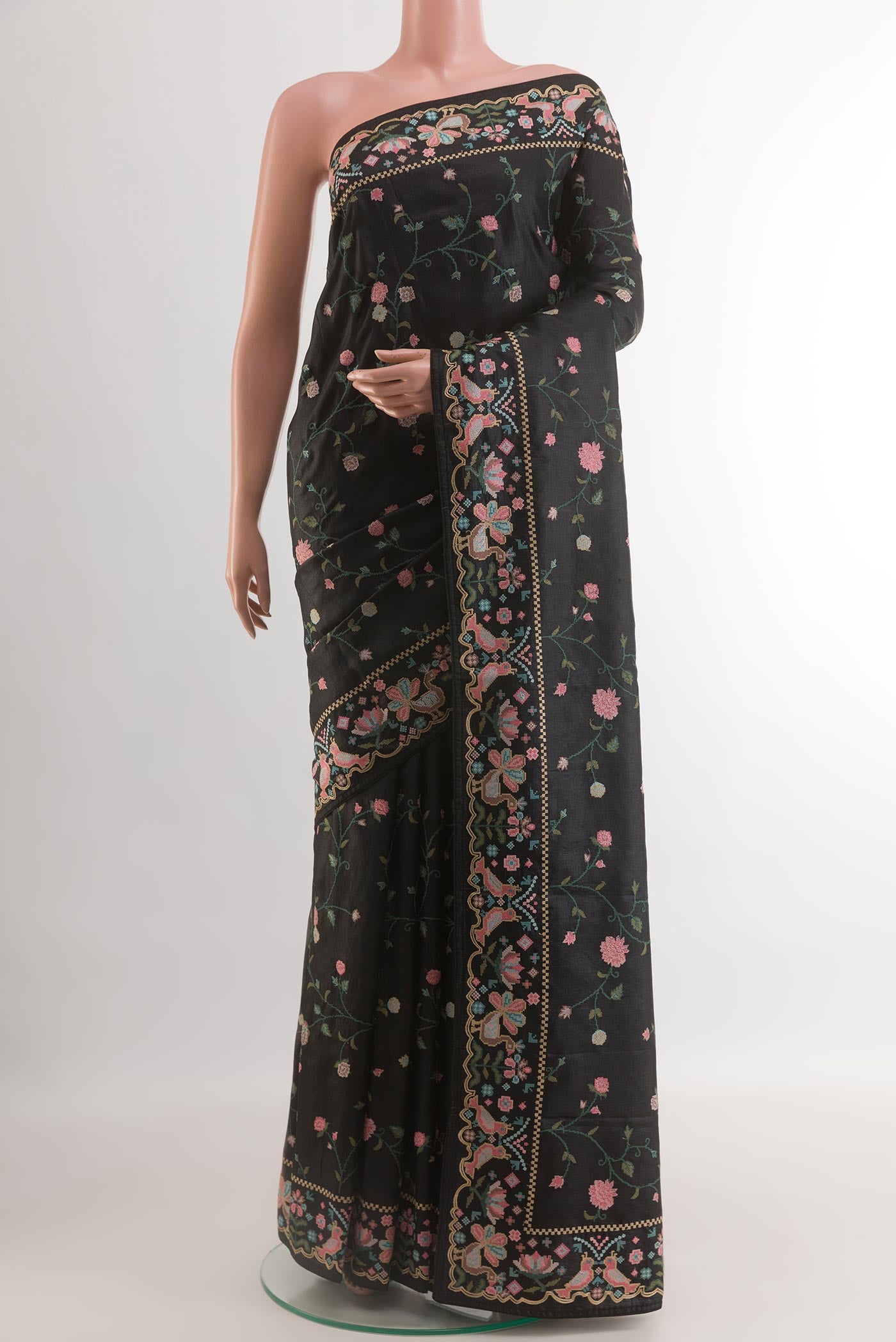 Black Tussar Silk Saree with Embroidery on the body and Embroidery Border.  displayed on a mannequin