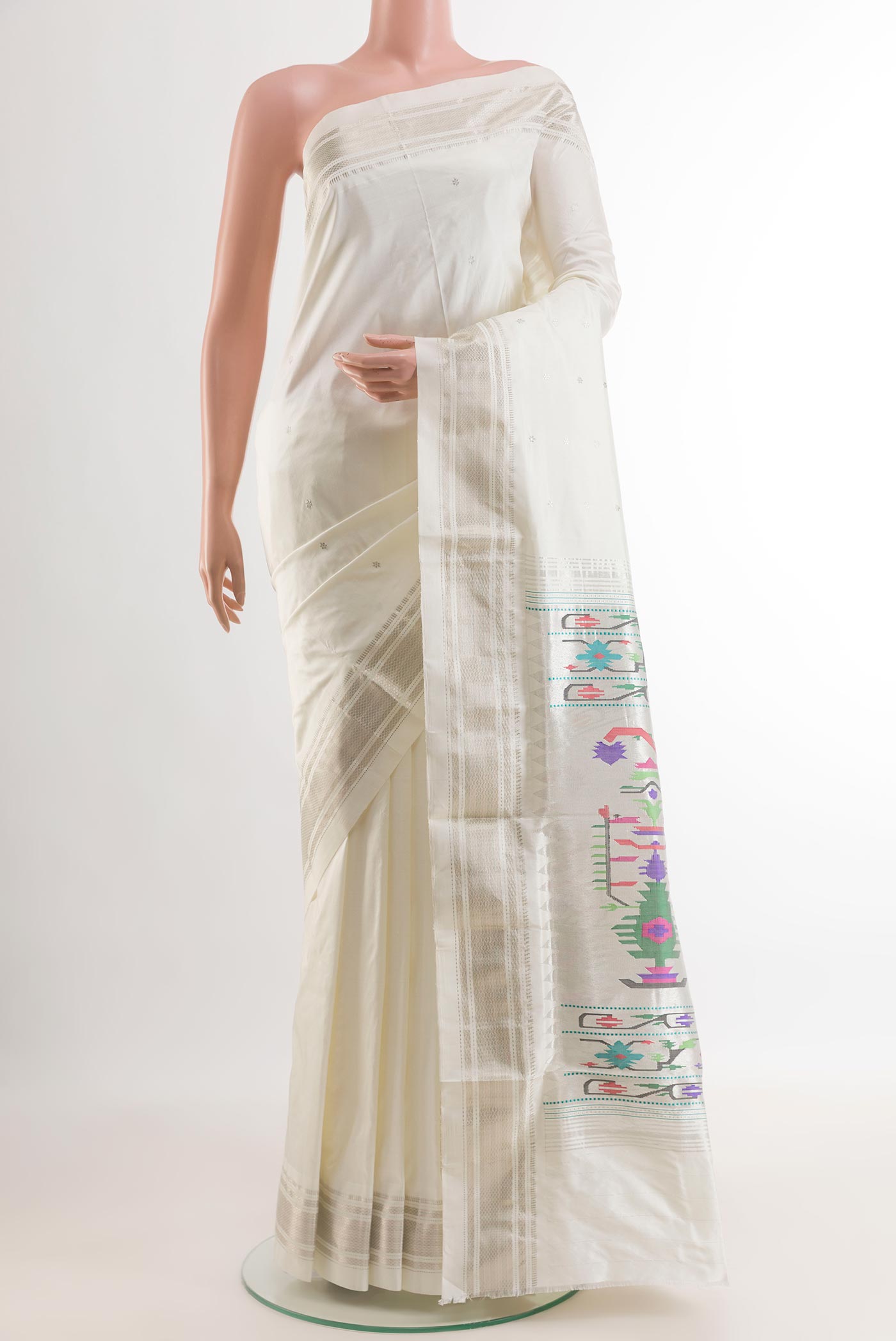 White Paithani Silk Saree with Zari Butta on the body and Zari Border.  displayed on a mannequin