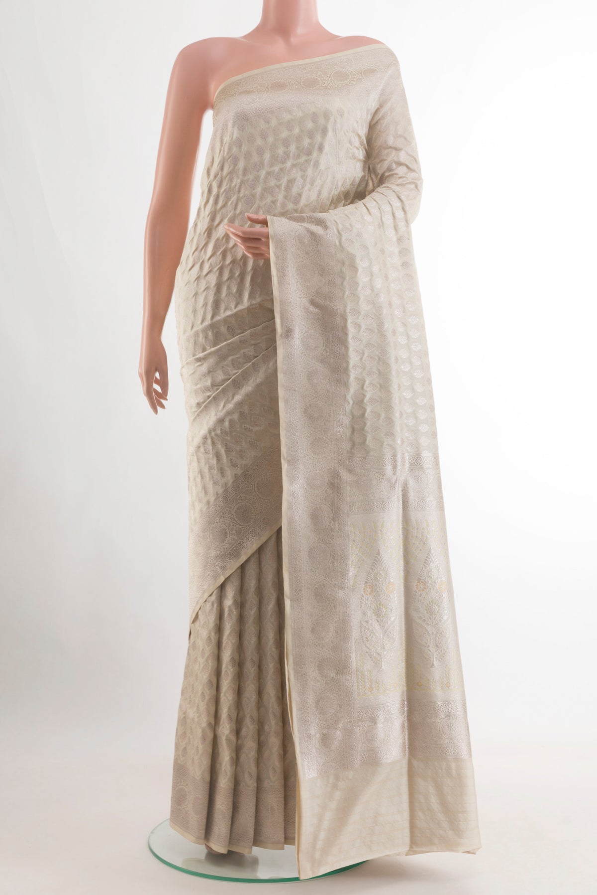 Off White Banarasi Silk Saree with Zari Butta on the body and Zari Border.  displayed on a mannequin
