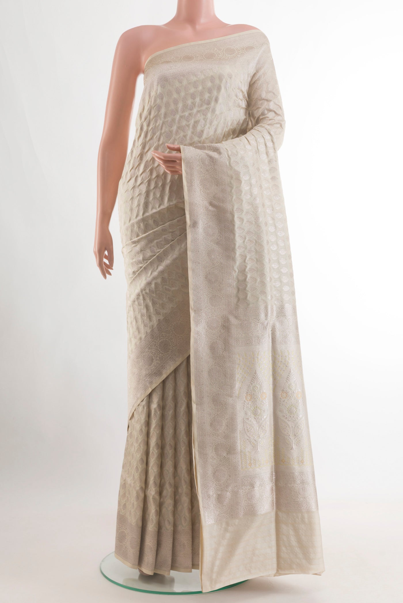 Off White Banarasi Silk Saree with Zari Butta on the body and Zari Border.  displayed on a mannequin