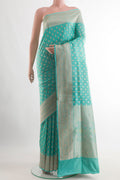 Blue Banarasi Silk Saree with Zari Butta on the body and Zari Border.  displayed on a mannequin