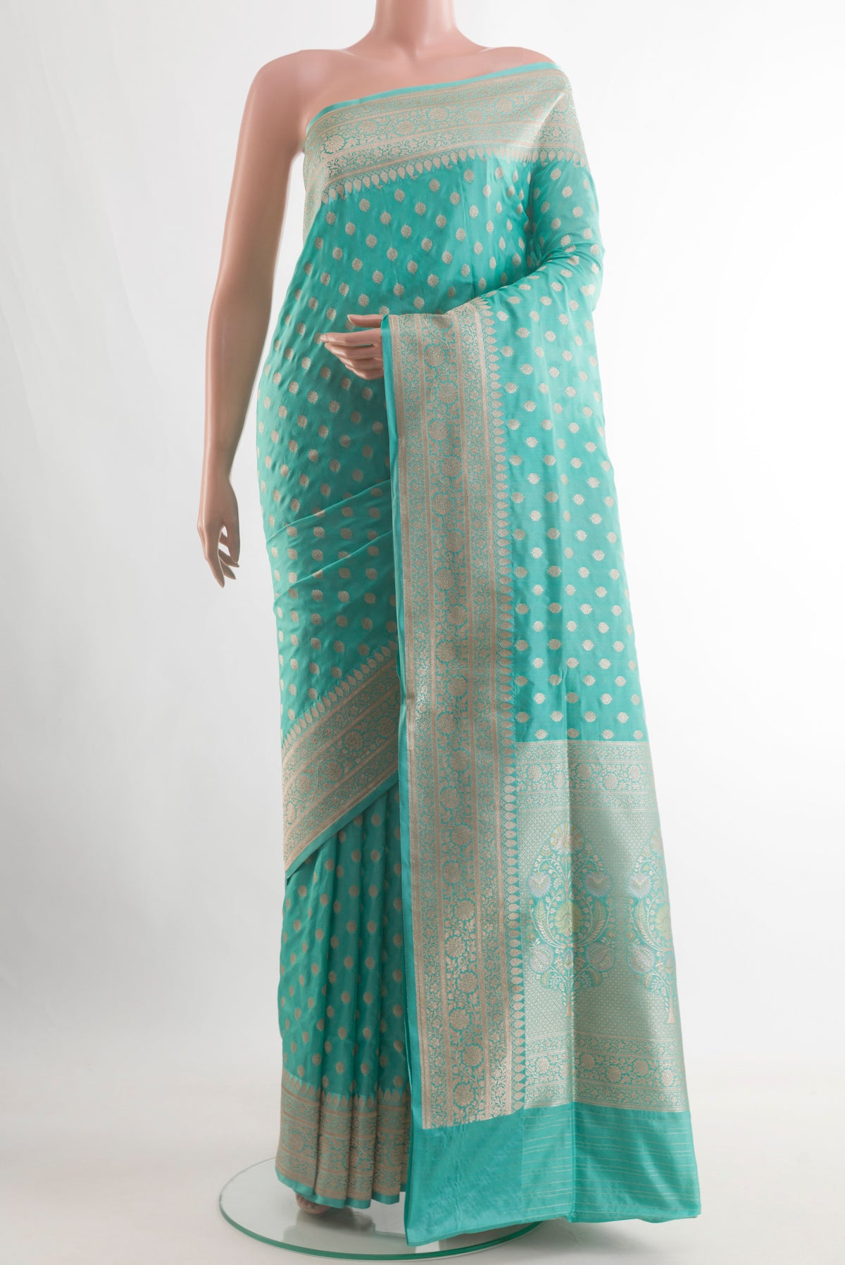 Blue Banarasi Silk Saree with Zari Butta on the body and Zari Border.  displayed on a mannequin