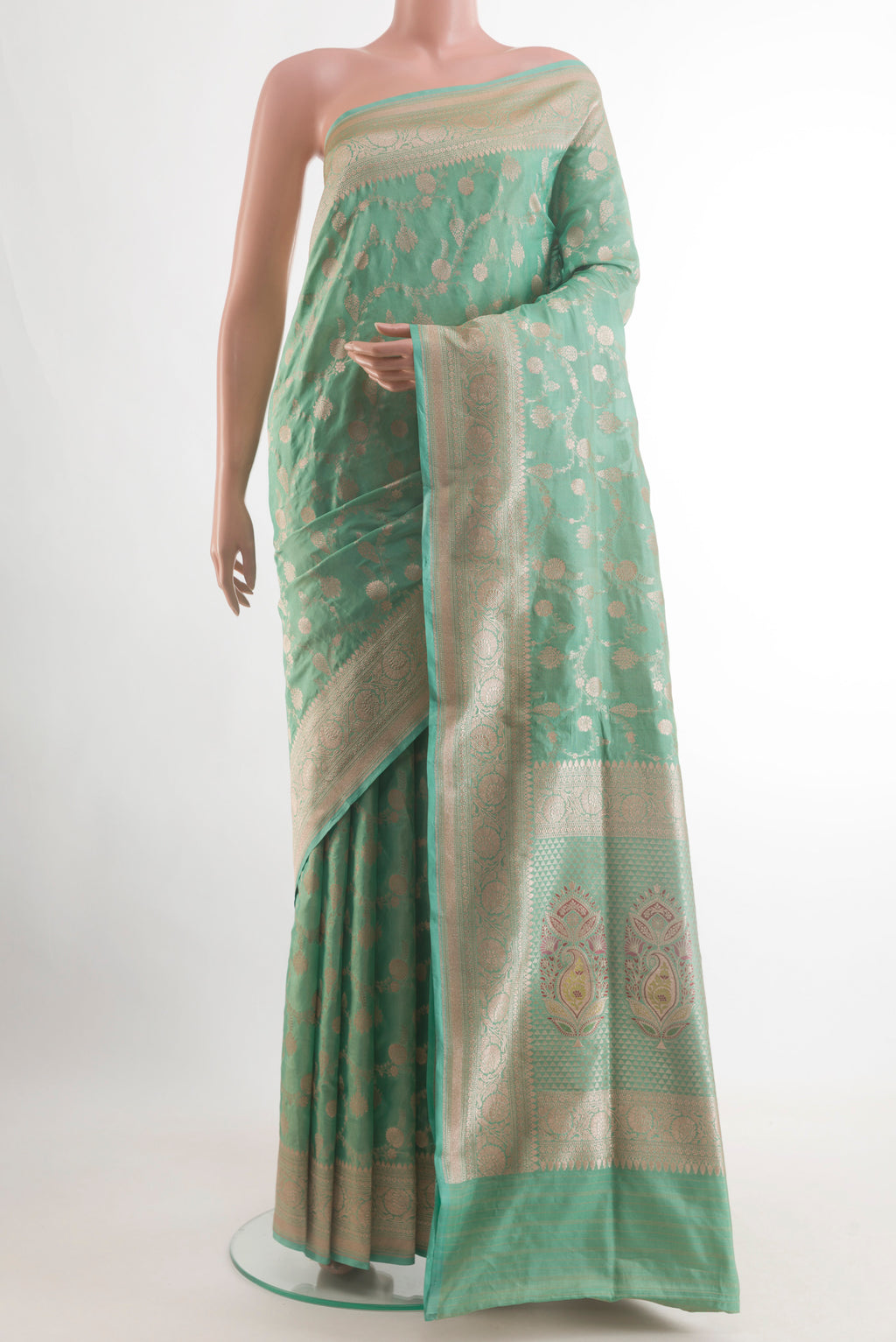 Sea Green Banarasi Tissue Silk Saree with Zari Brocade on the body and Zari Border.  displayed on a mannequin