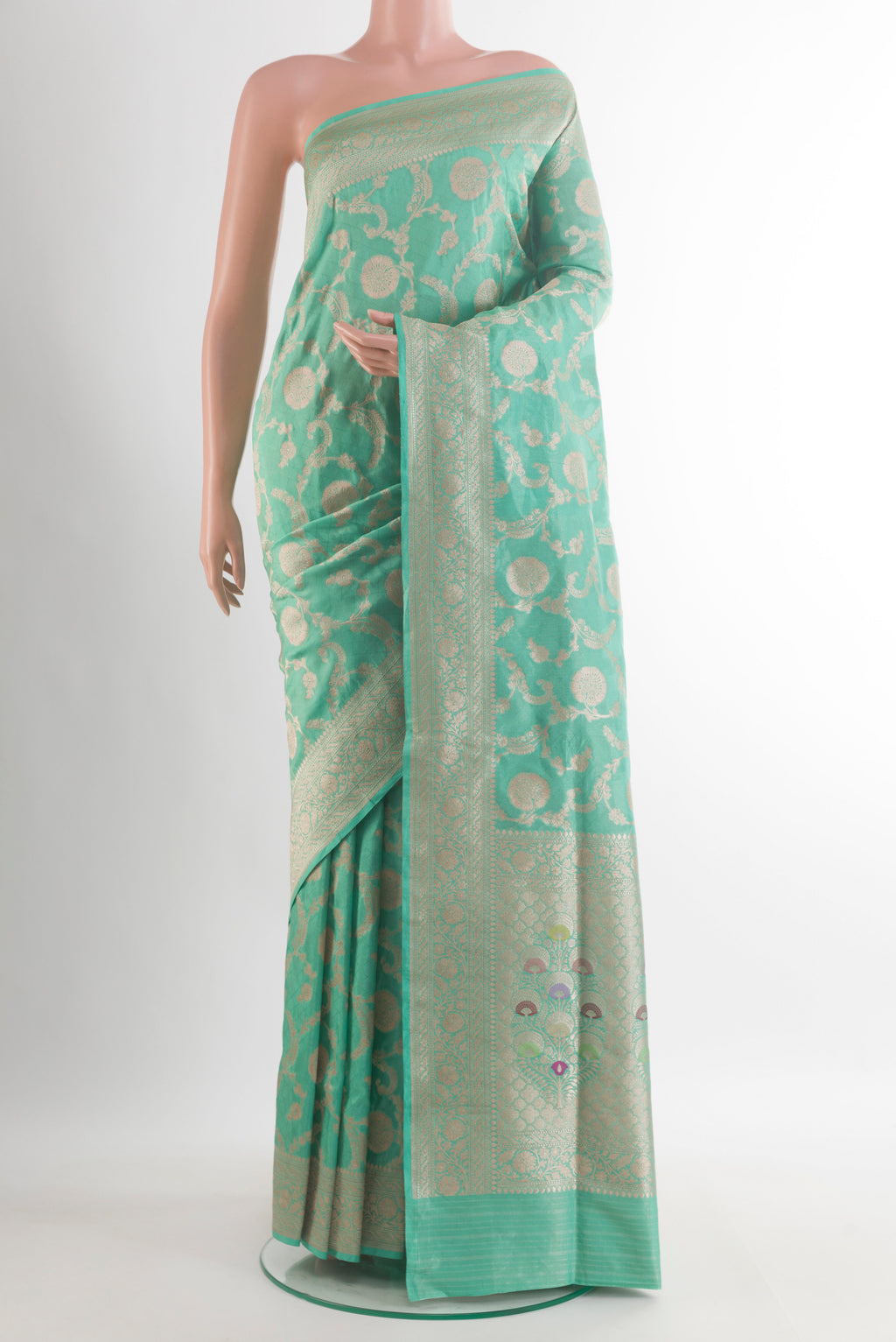 Pure Silk Sea Green Banarasi Saree with Zari Brocade on the body and Zari Border.  displayed on a mannequin
