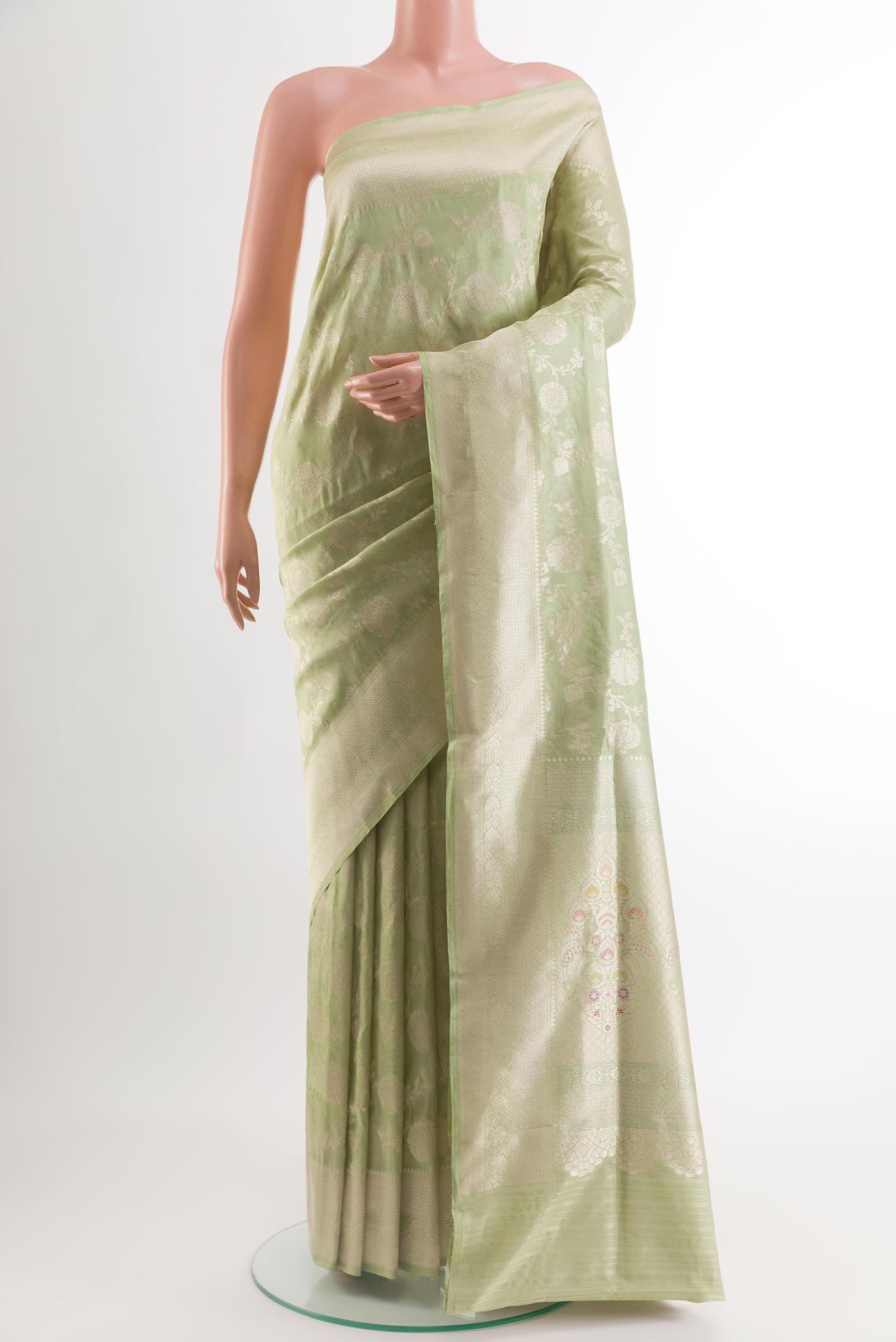 Light Green Banarasi Silk Saree with Zari Brocade on the body and Zari Border.  displayed on a mannequin