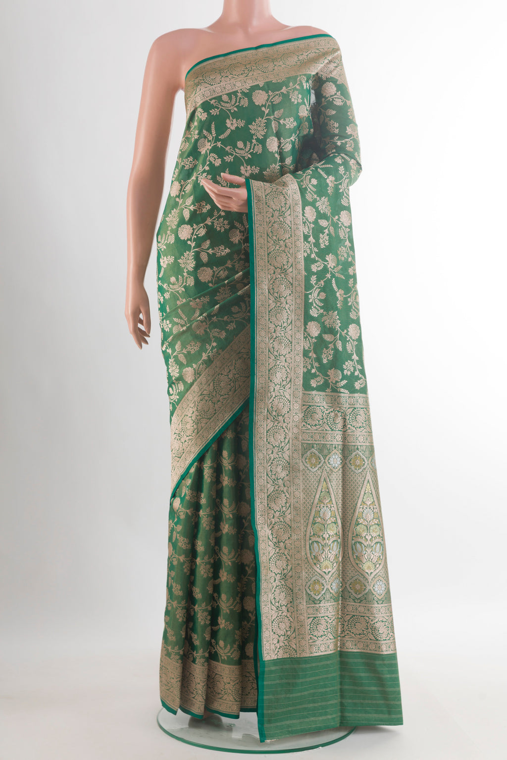 Pure Silk Green Banarasi Saree with Zari Brocade on the body and Zari Border.  displayed on a mannequin