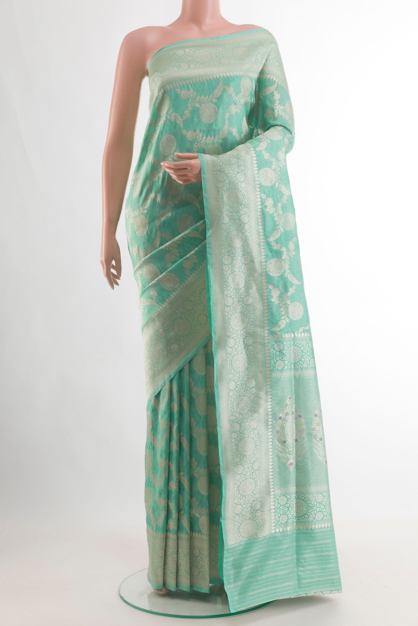 Pure Silk Sea Green Banarasi Saree with Zari Brocade on the body and Zari Border.  displayed on a mannequin