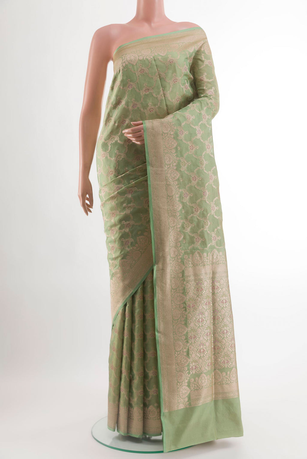 Green Banarasi Silk Saree with Zari Brocade on the body and Zari Border.  displayed on a mannequin
